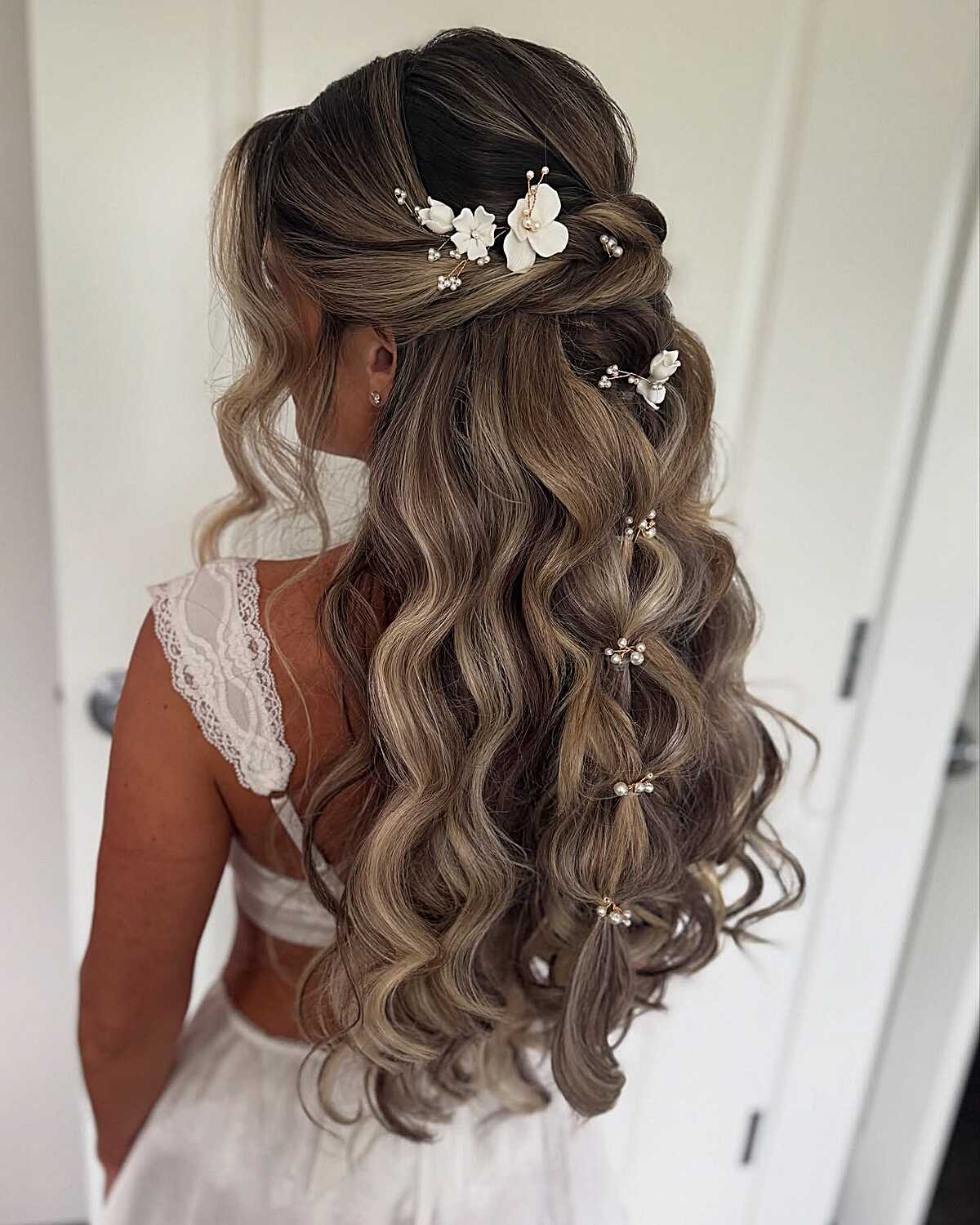 Bridal half up with hair vine and flowing waves
