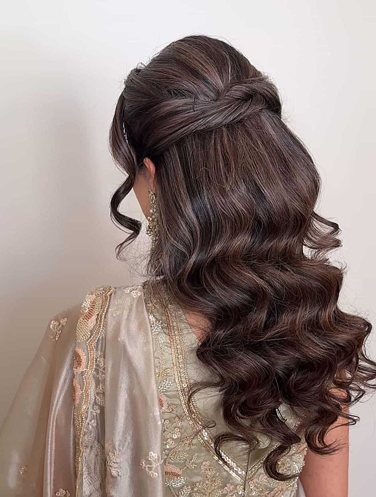 Dark brunette half up with full voluminous curls