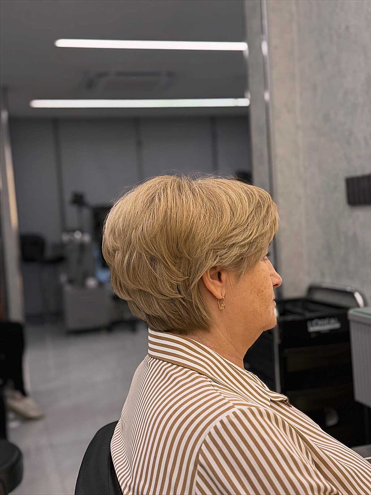 Warm honey blonde short bixie with layered back