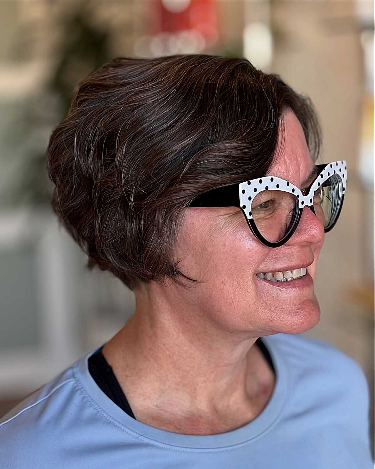 Wavy dark brunette bixie with soft sides and glasses