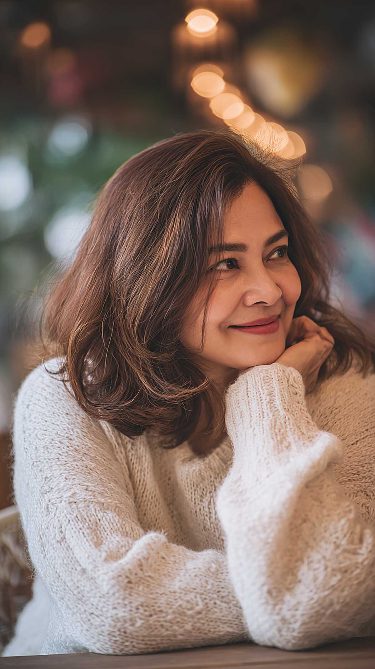 Classic brunette layered bob with blow-dried soft curled ends