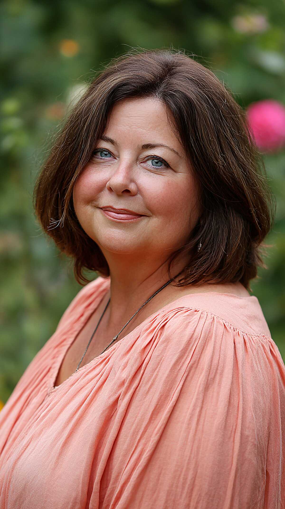 Dark brunette layered bob with textured volume outdoors