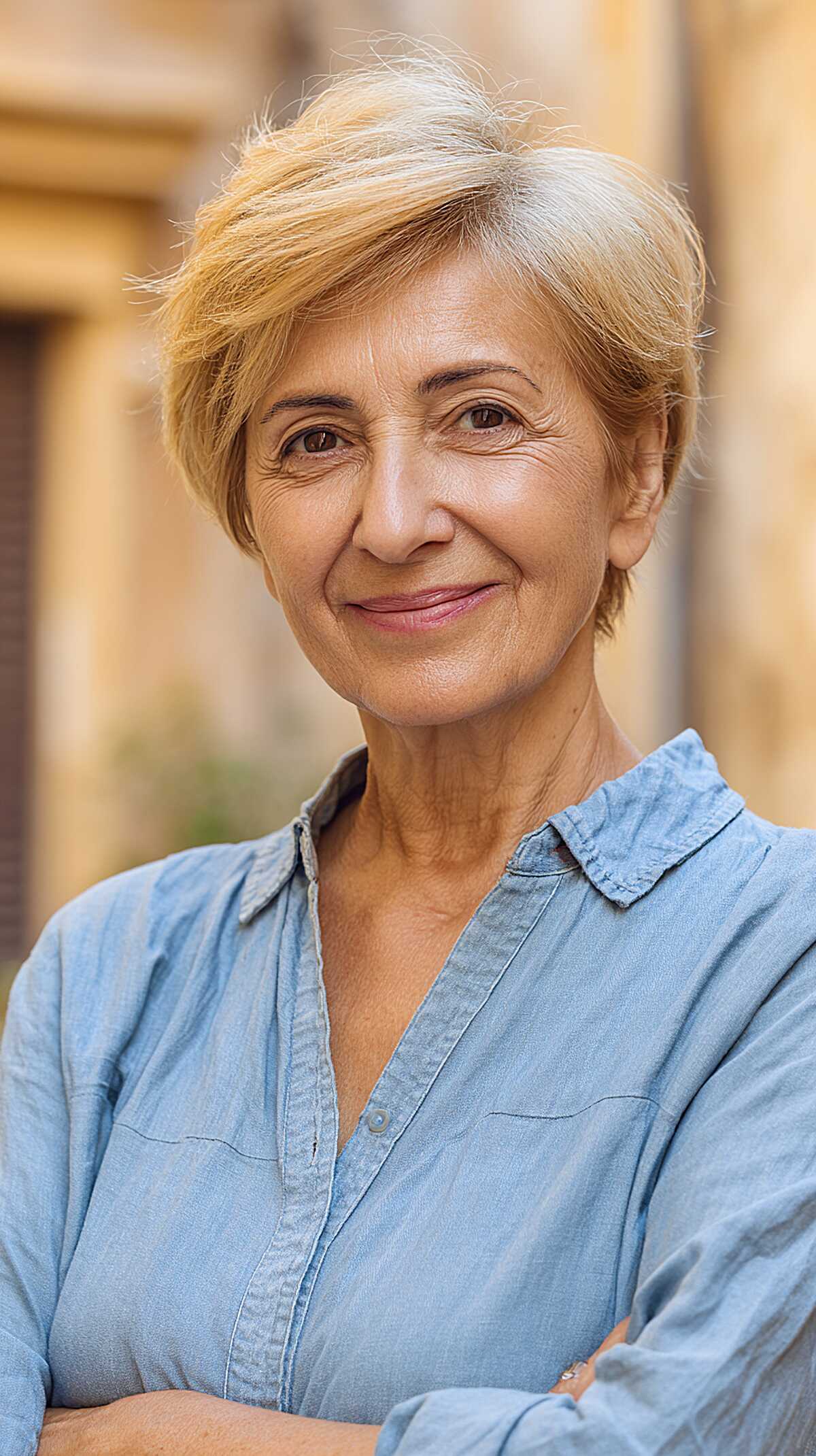 Neat blonde side-parted long pixie with tapered sides