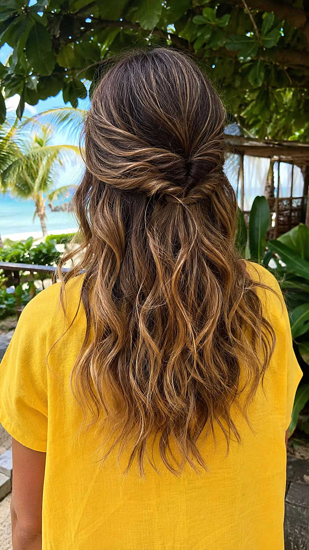 Brunette balayage half up twist with beachy waves