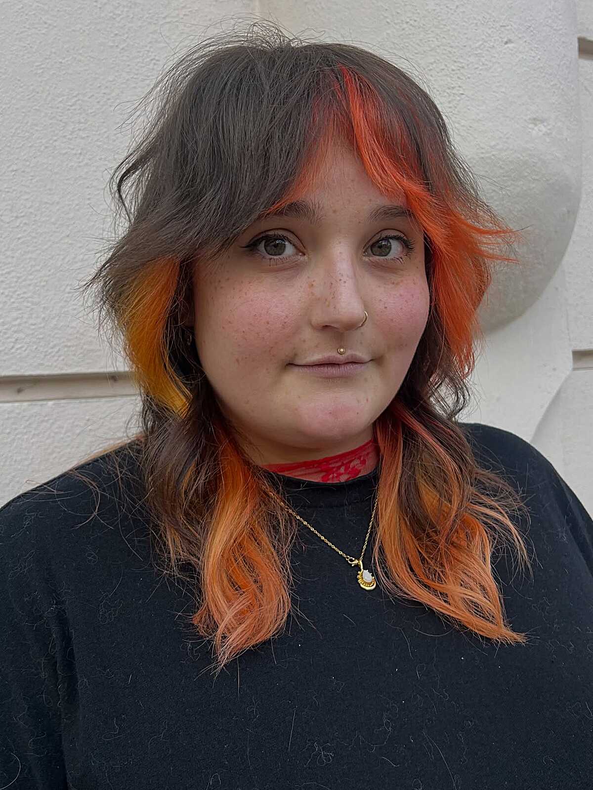 Shaggy medium cut with dark roots and orange ends