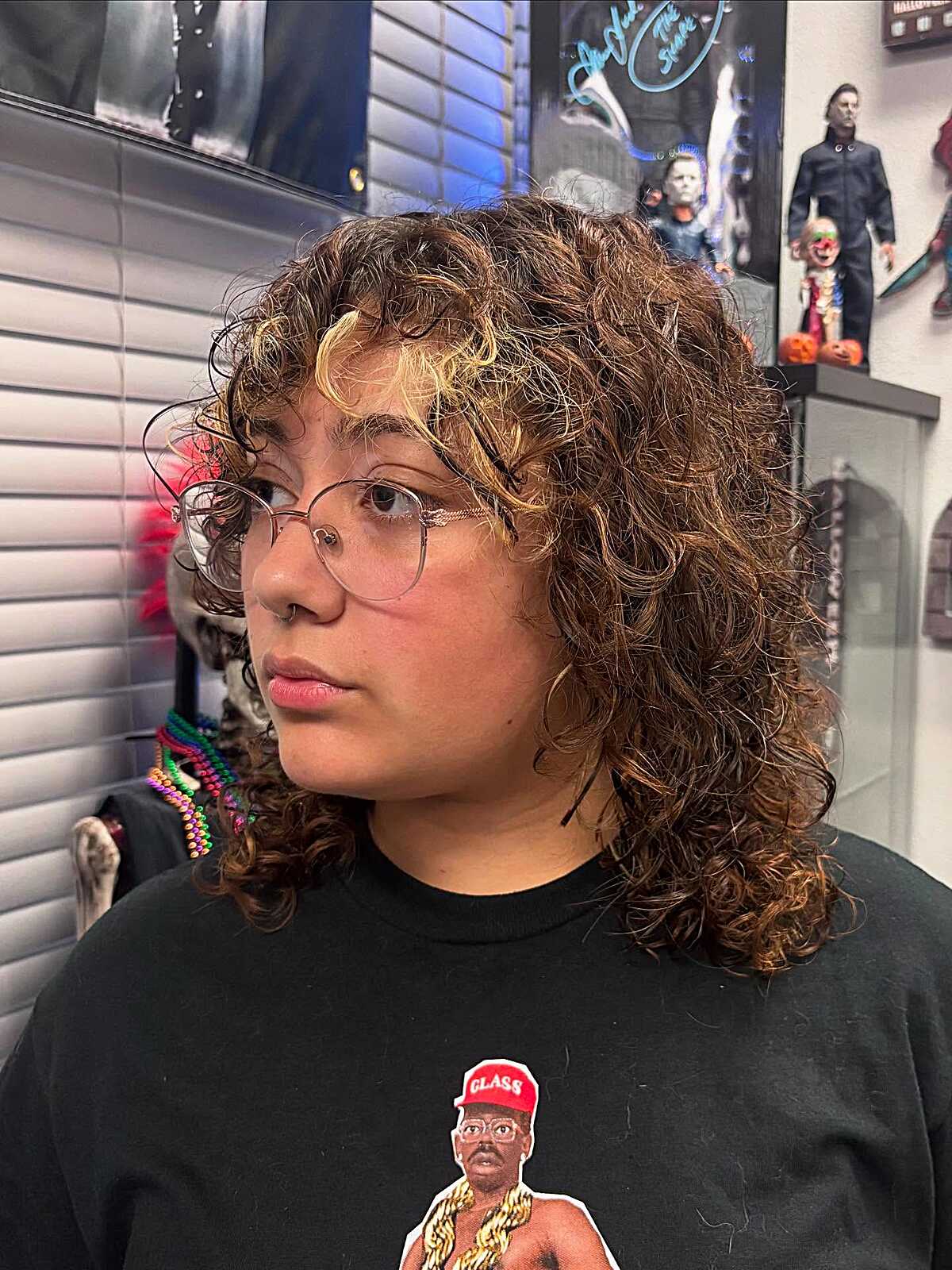 Curly brown shag with blonde face-framing highlights