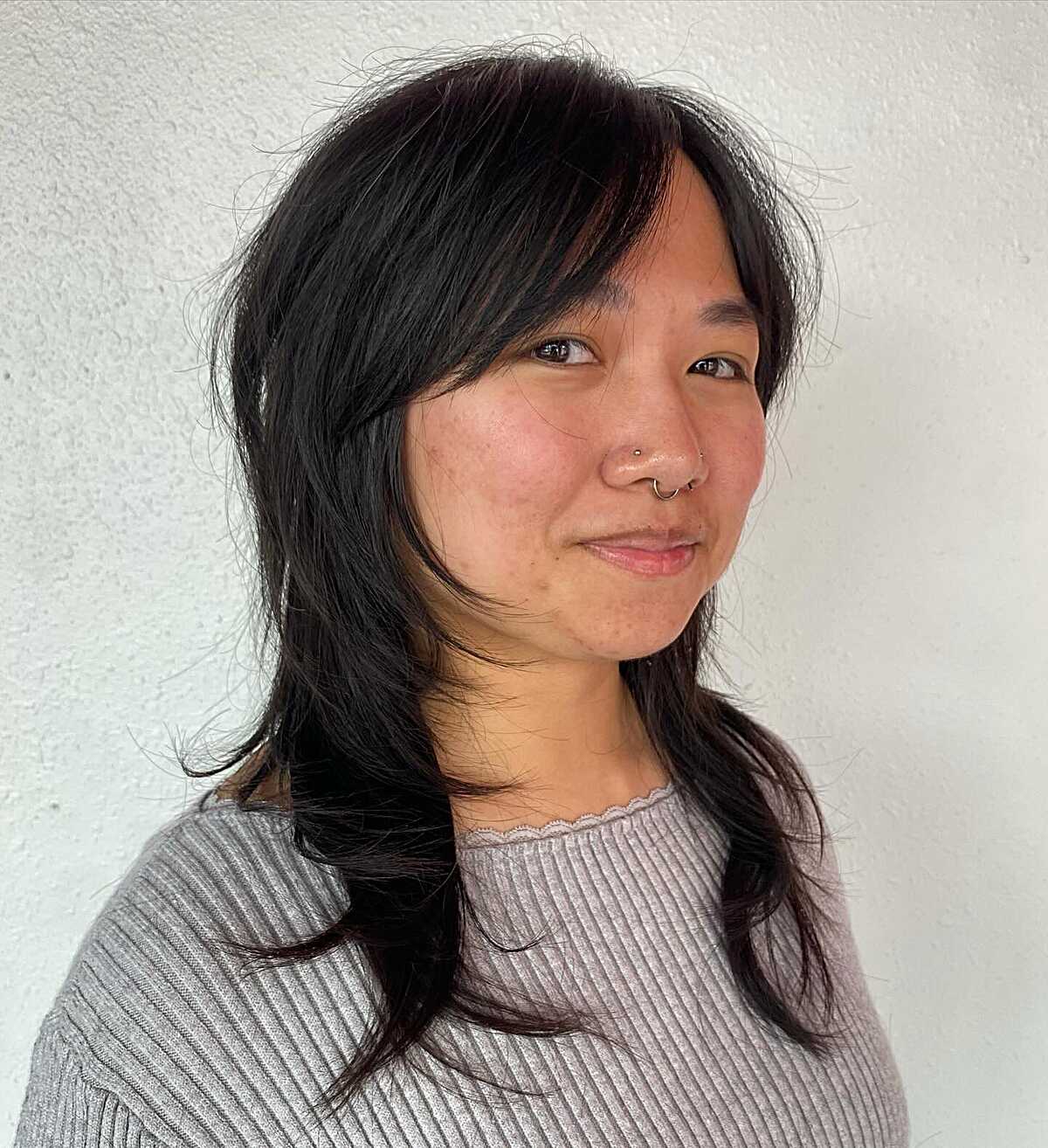 Black medium shag with side-swept layered fringe
