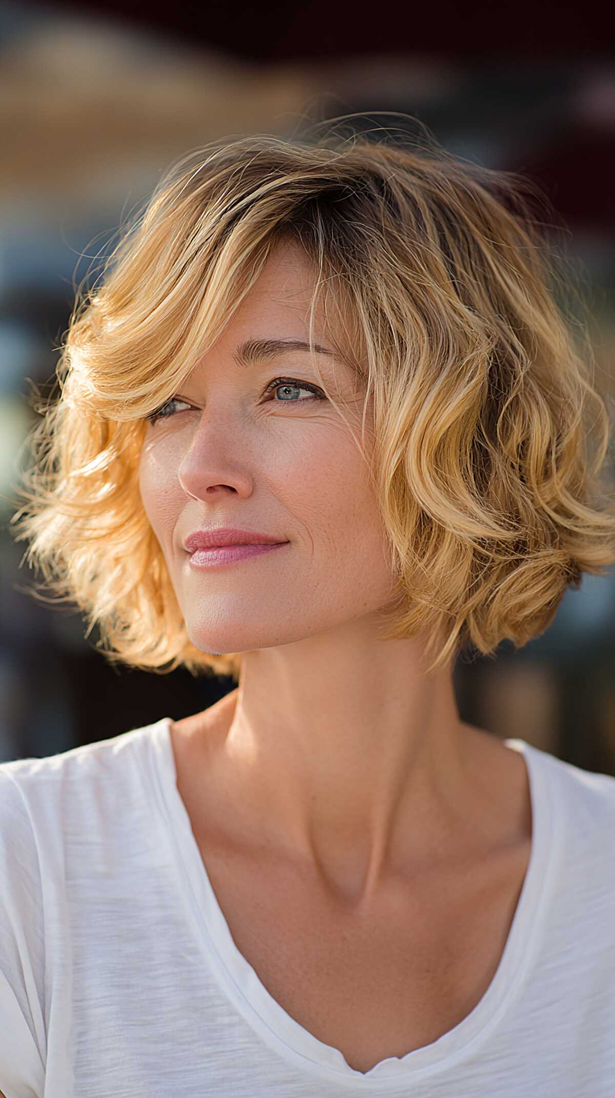 Golden blonde chin-length bob with loose tousled waves