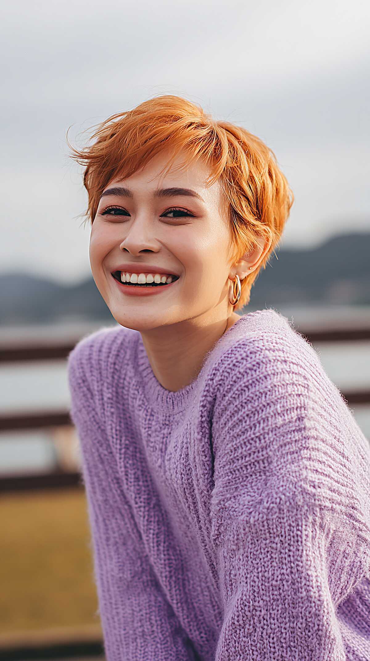Bright tangerine orange textured short pixie cut