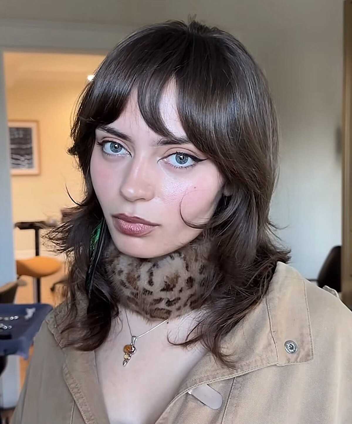 Dark brown medium shag with curtain bangs and flipped ends
