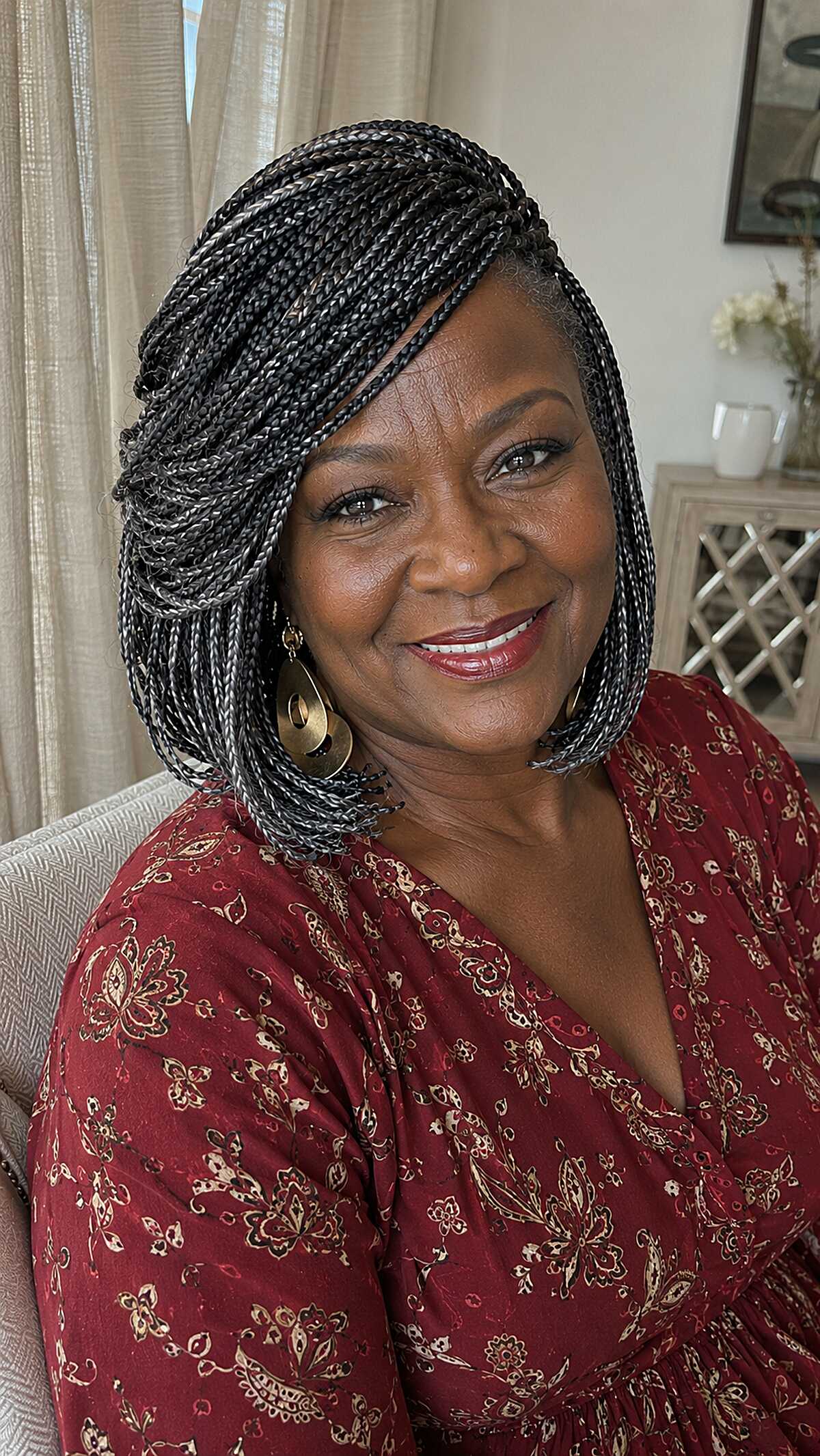 Salt and pepper knotless braided bob with side sweep