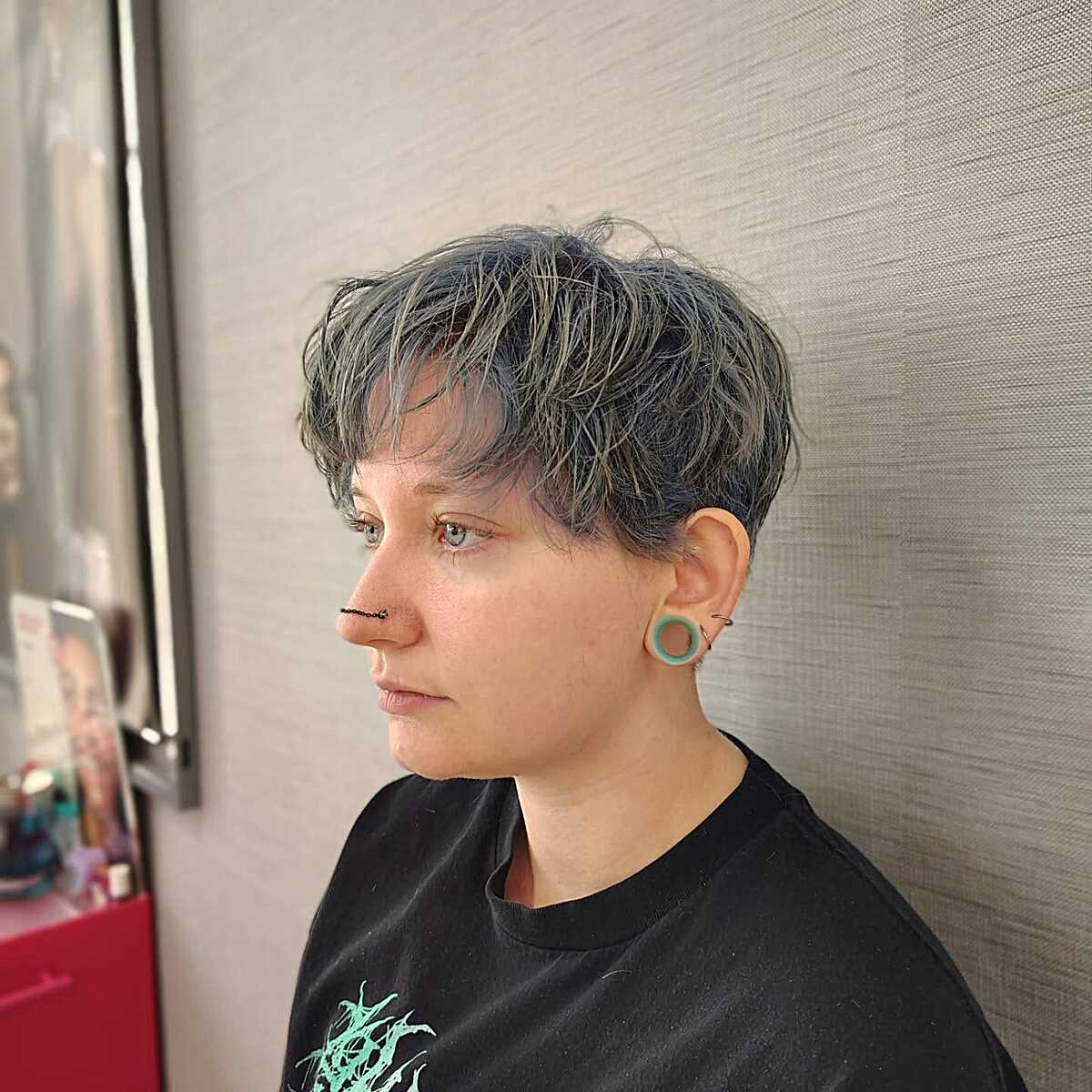 Salt and pepper textured pixie with choppy bangs