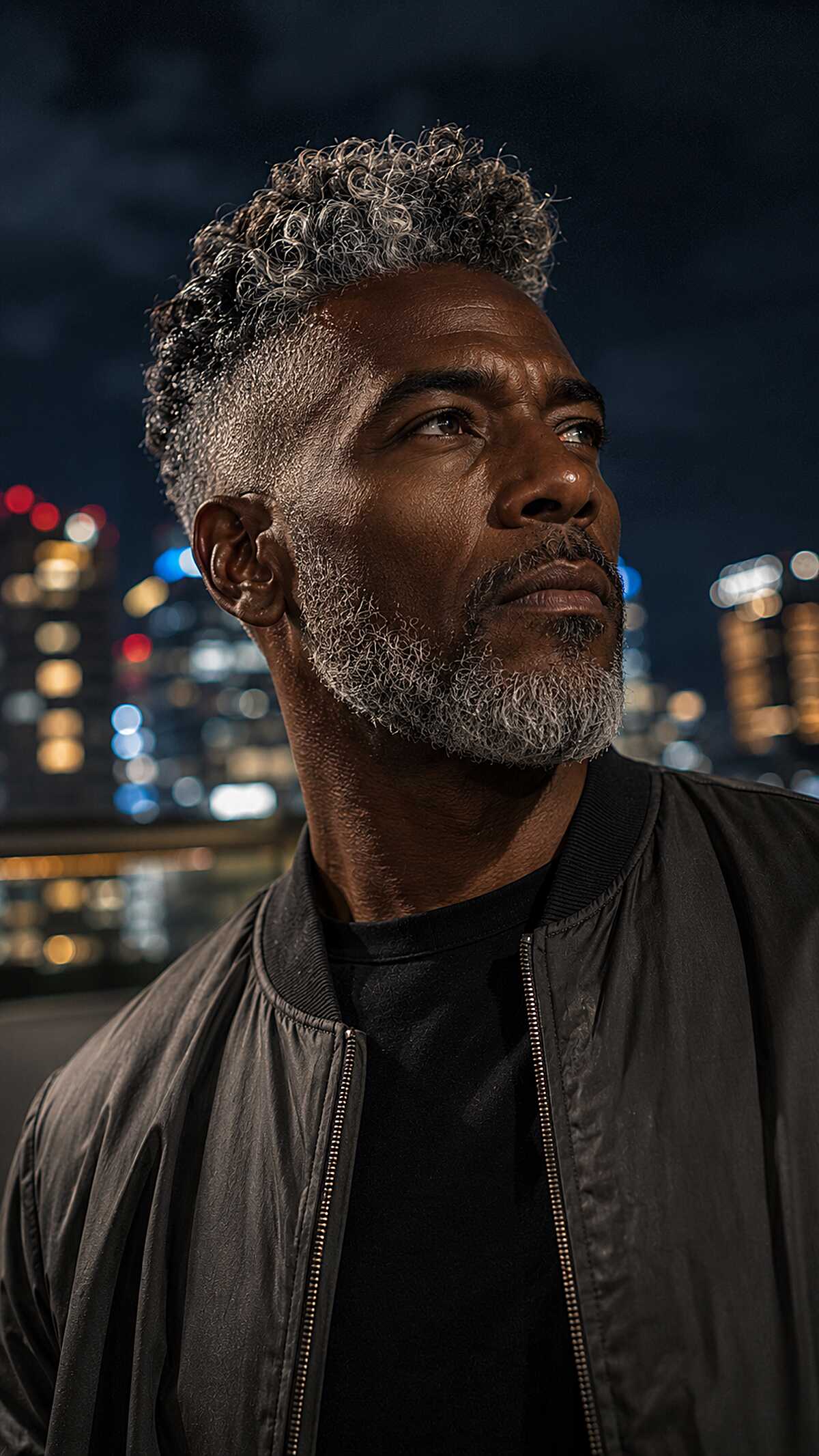 Grey coily hair with tapered fade and grey beard