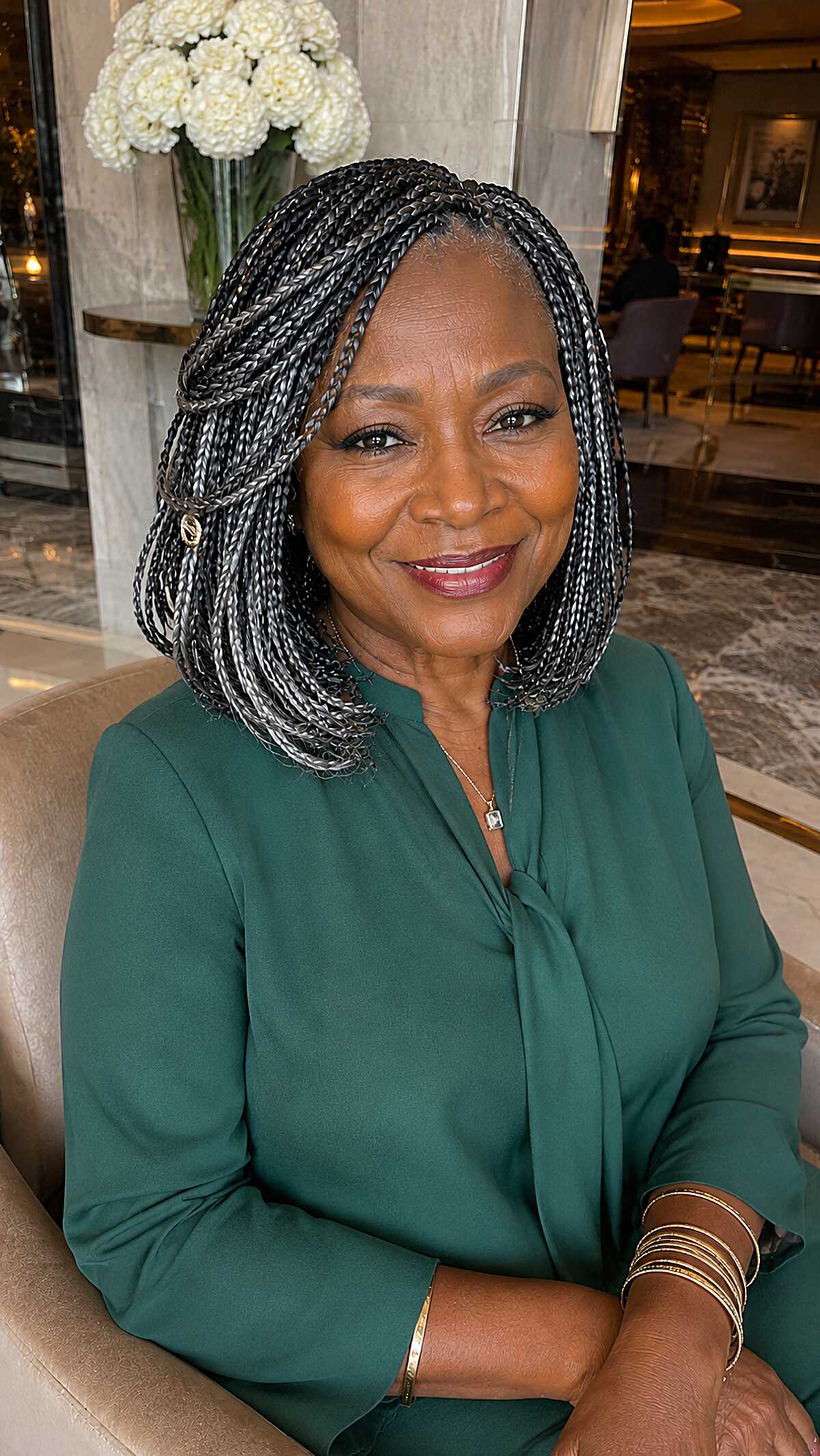 Silver-streaked knotless braids in a soft bob length