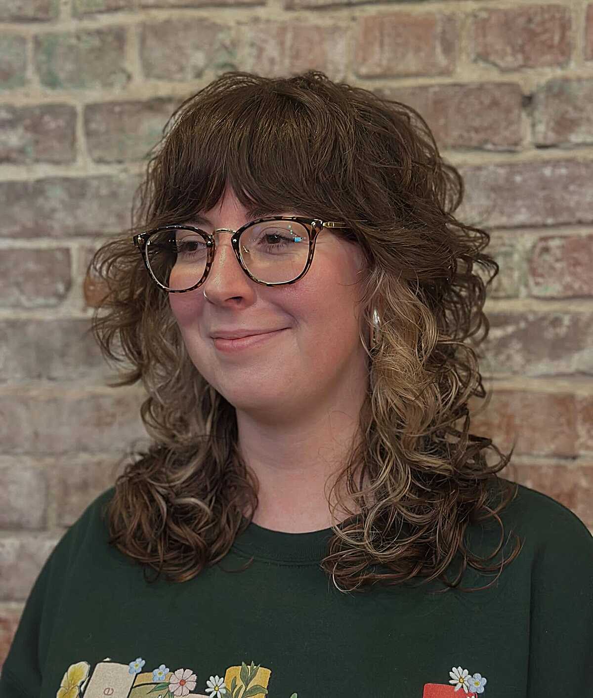 Medium curly brown shag with lighter blonde ends
