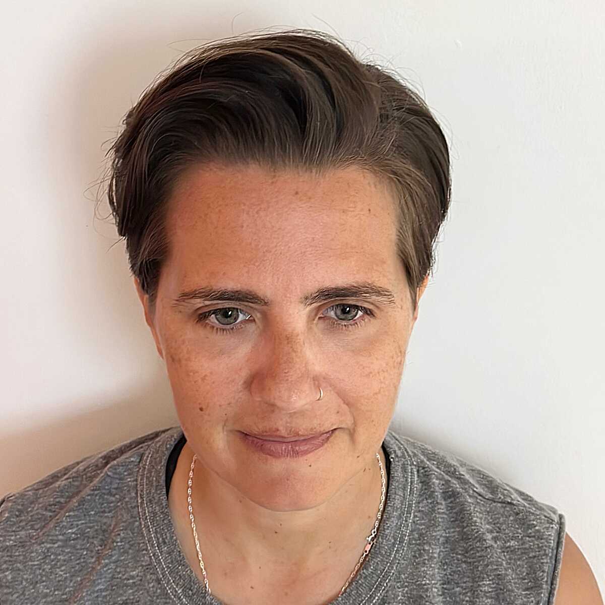 Brown swept-back tapered crop with soft natural texture
