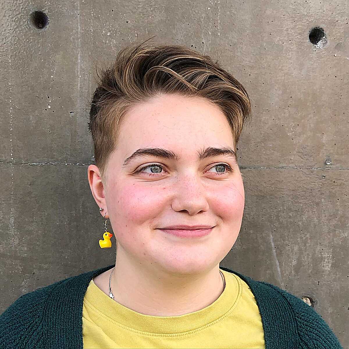 Brown undercut with highlighted top swept up and to the side