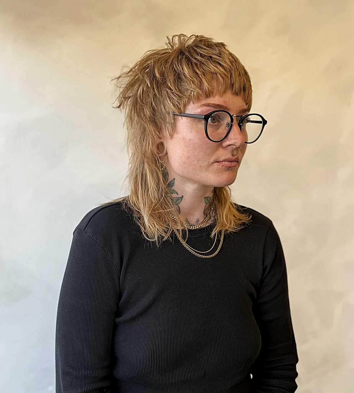 Choppy strawberry blonde mullet-shag with short bangs
