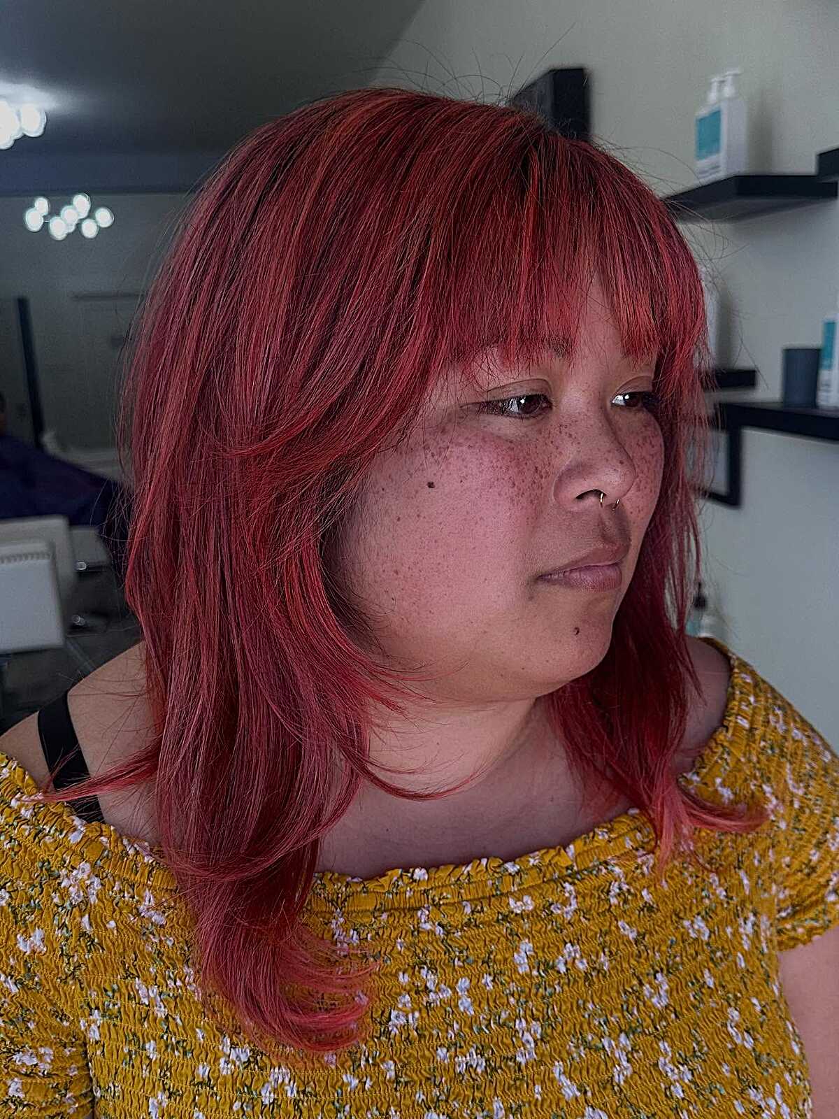 Vivid red medium shag with layered fringe and flipped ends