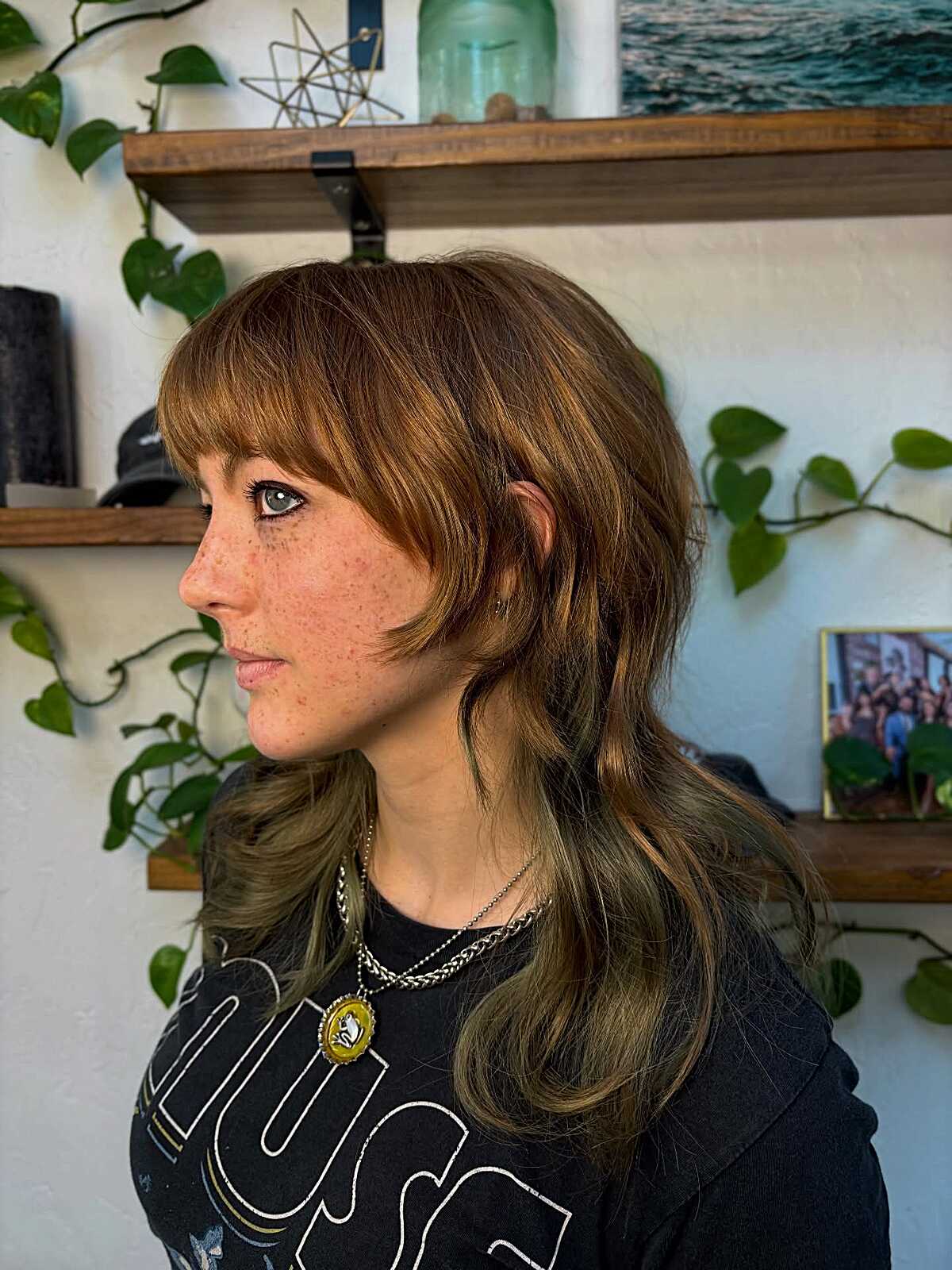 Warm auburn shag with curtain bangs and wavy layers