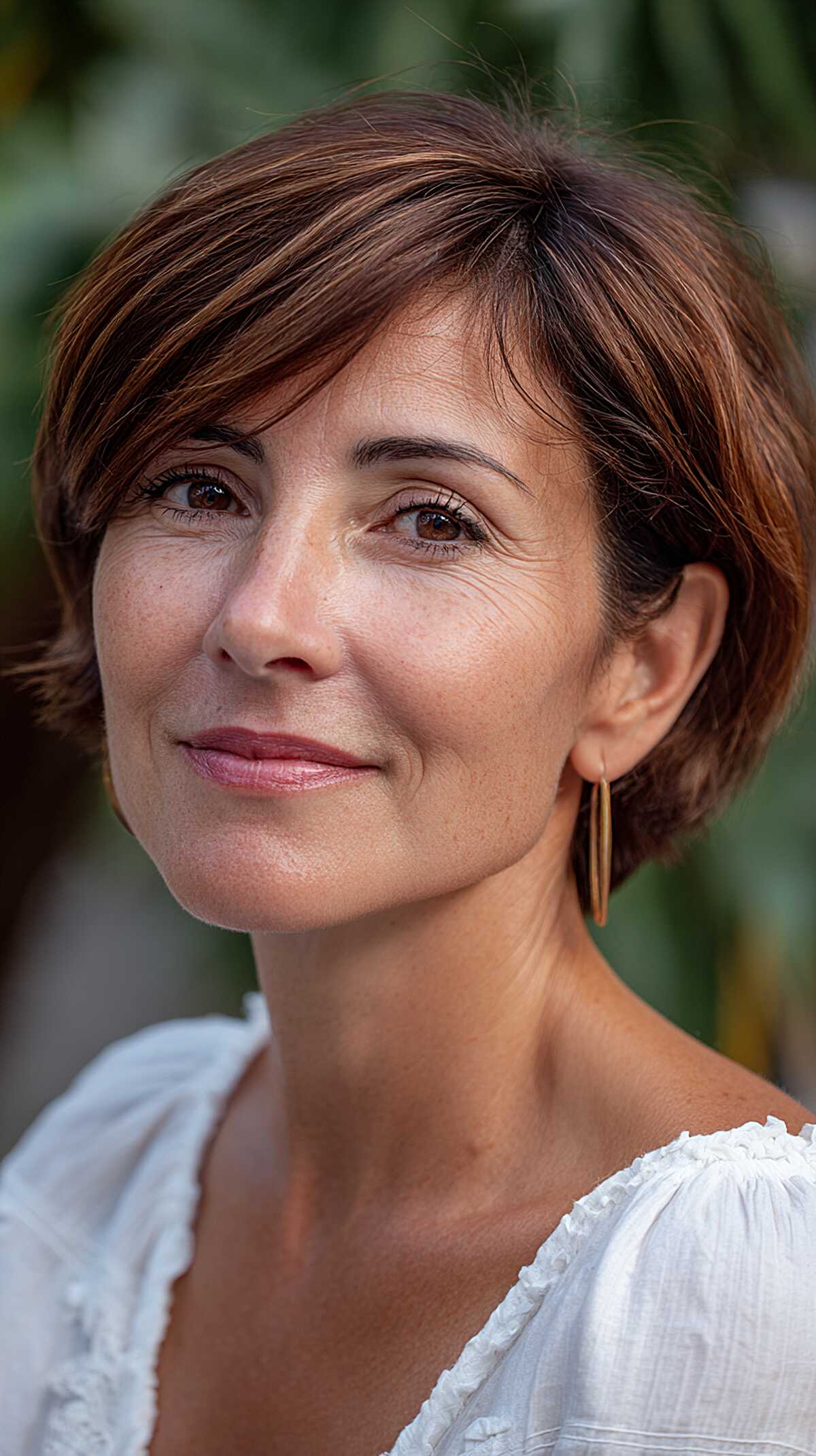 Short auburn bob with micro layers and soft wispy fringe