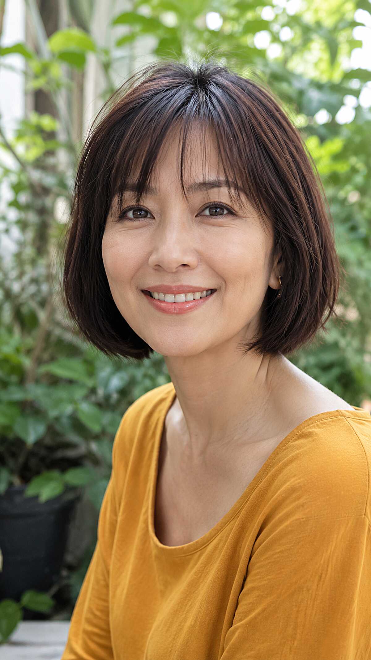 Classic dark brown bob with full straight fringe
