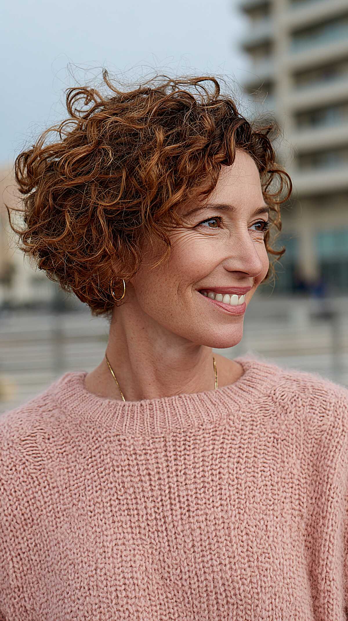 Short tight curly bob with copper and auburn highlights