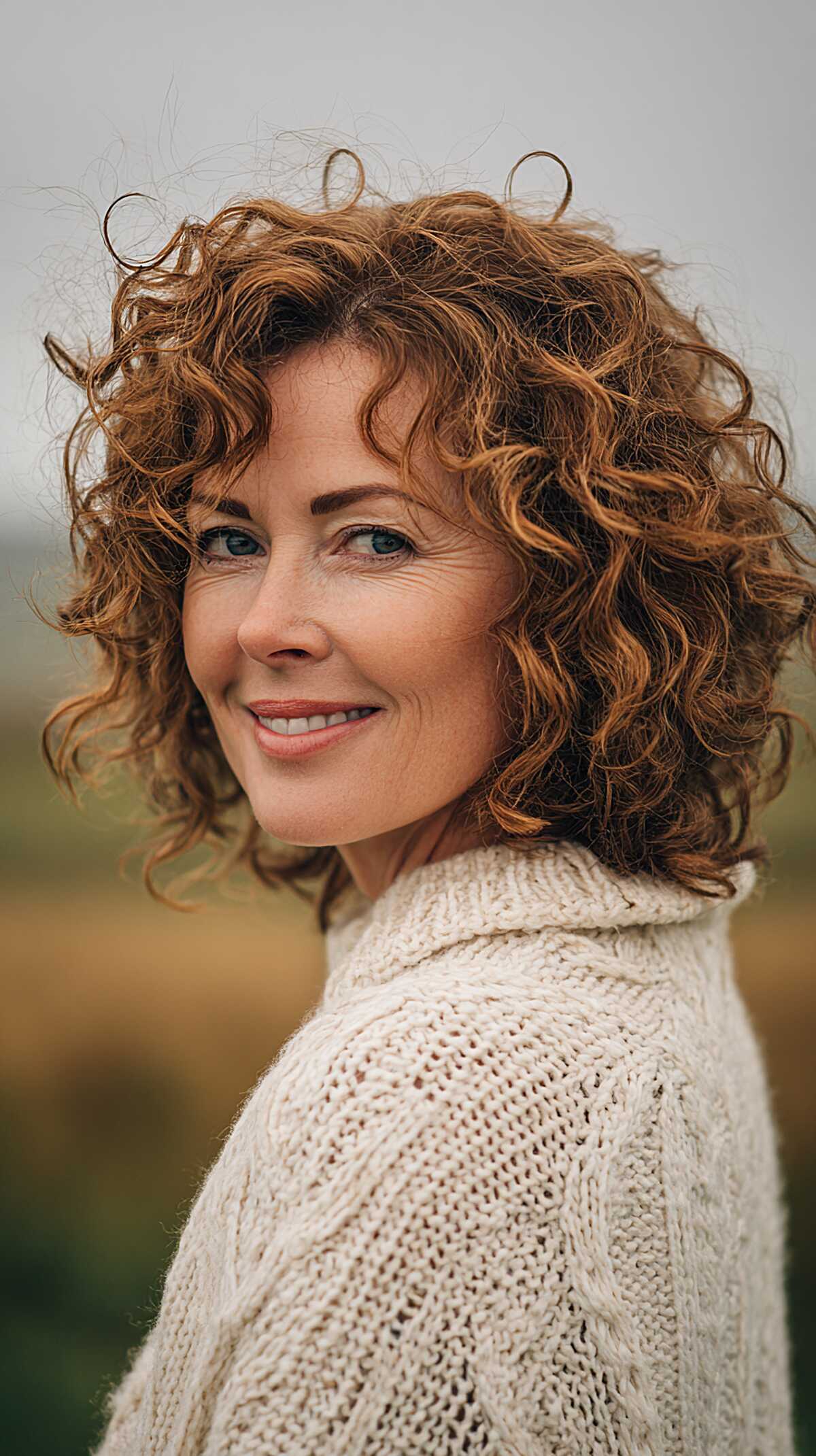 Copper red ringlet bob with defined spiraling curl ends