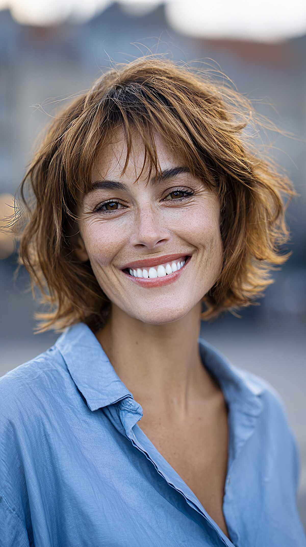 Golden brunette wavy shaggy bob with choppy fringe