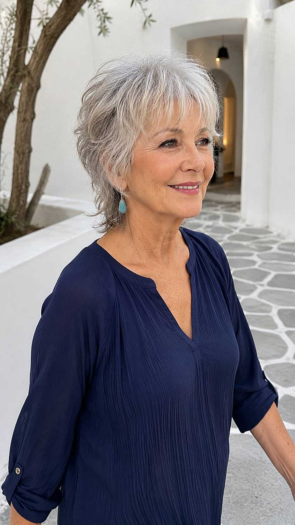 Silver shaggy pixie with feathered fringe and layers