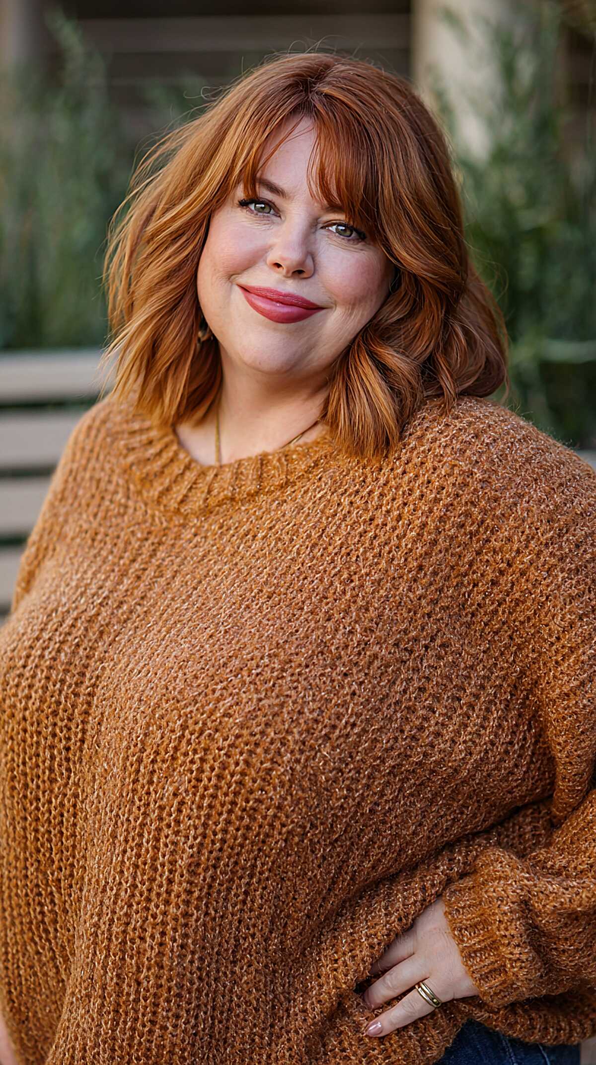 Copper ginger shoulder-length shag with curtain bangs