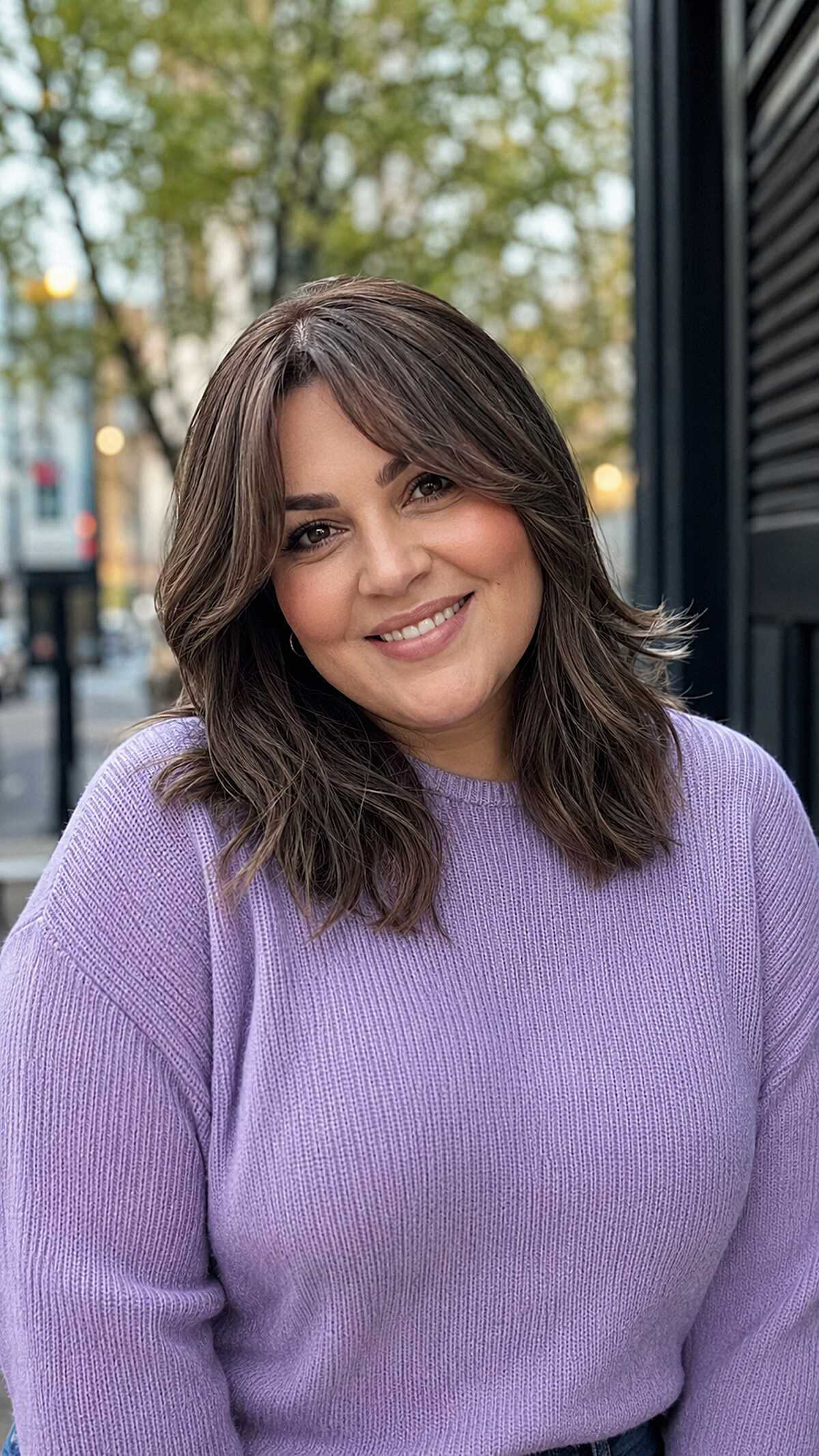 Medium-length feathered brown hair with soft highlights