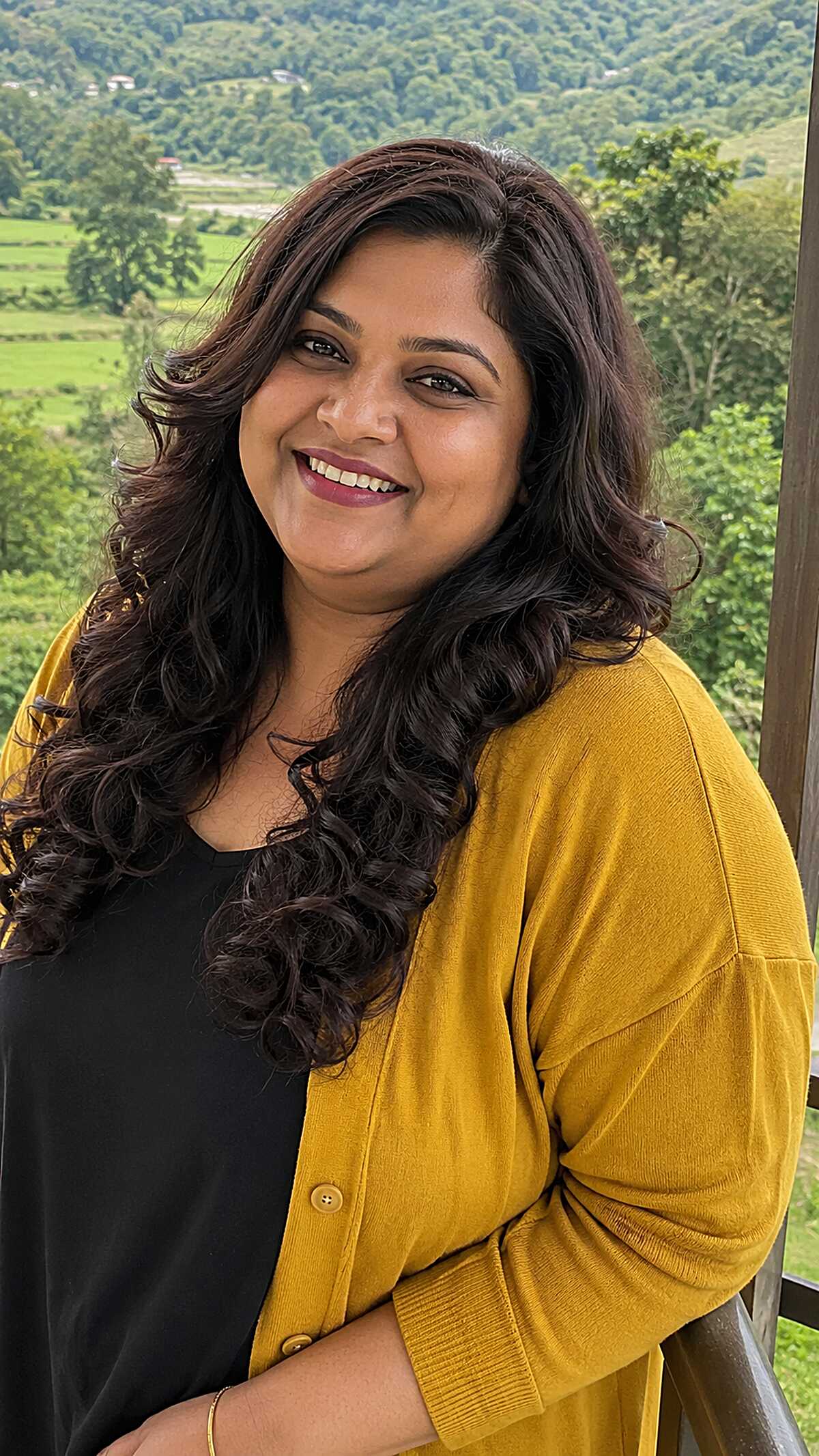 Long dark wavy hair with defined curls at the ends