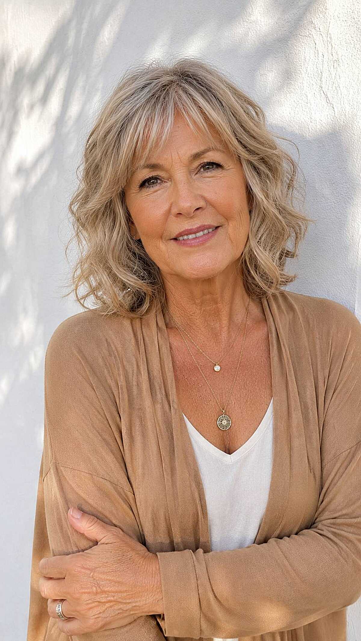 Soft blonde wavy lob with breezy curtain bangs