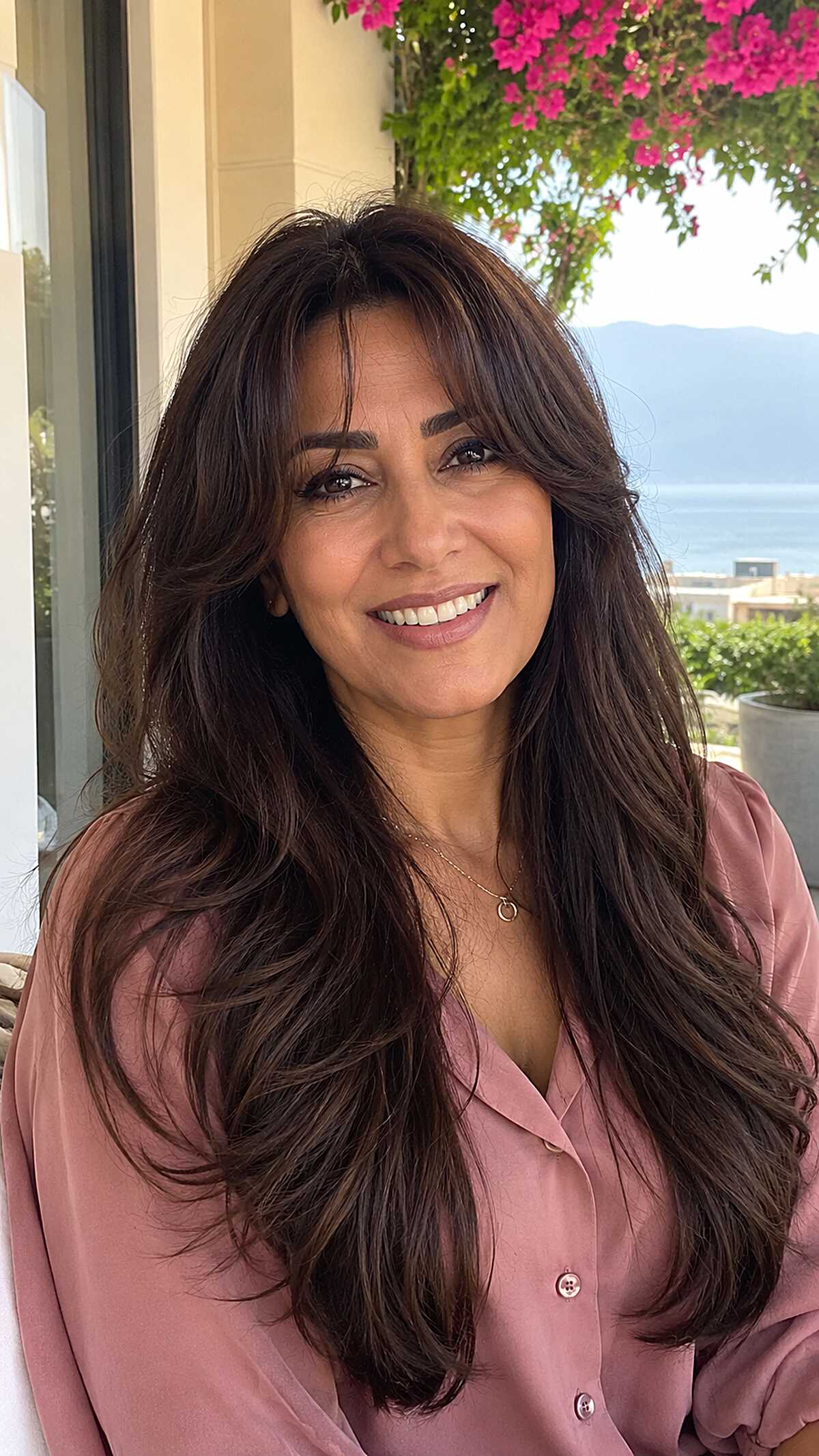 Voluminous dark chocolate long hair with curtain bangs