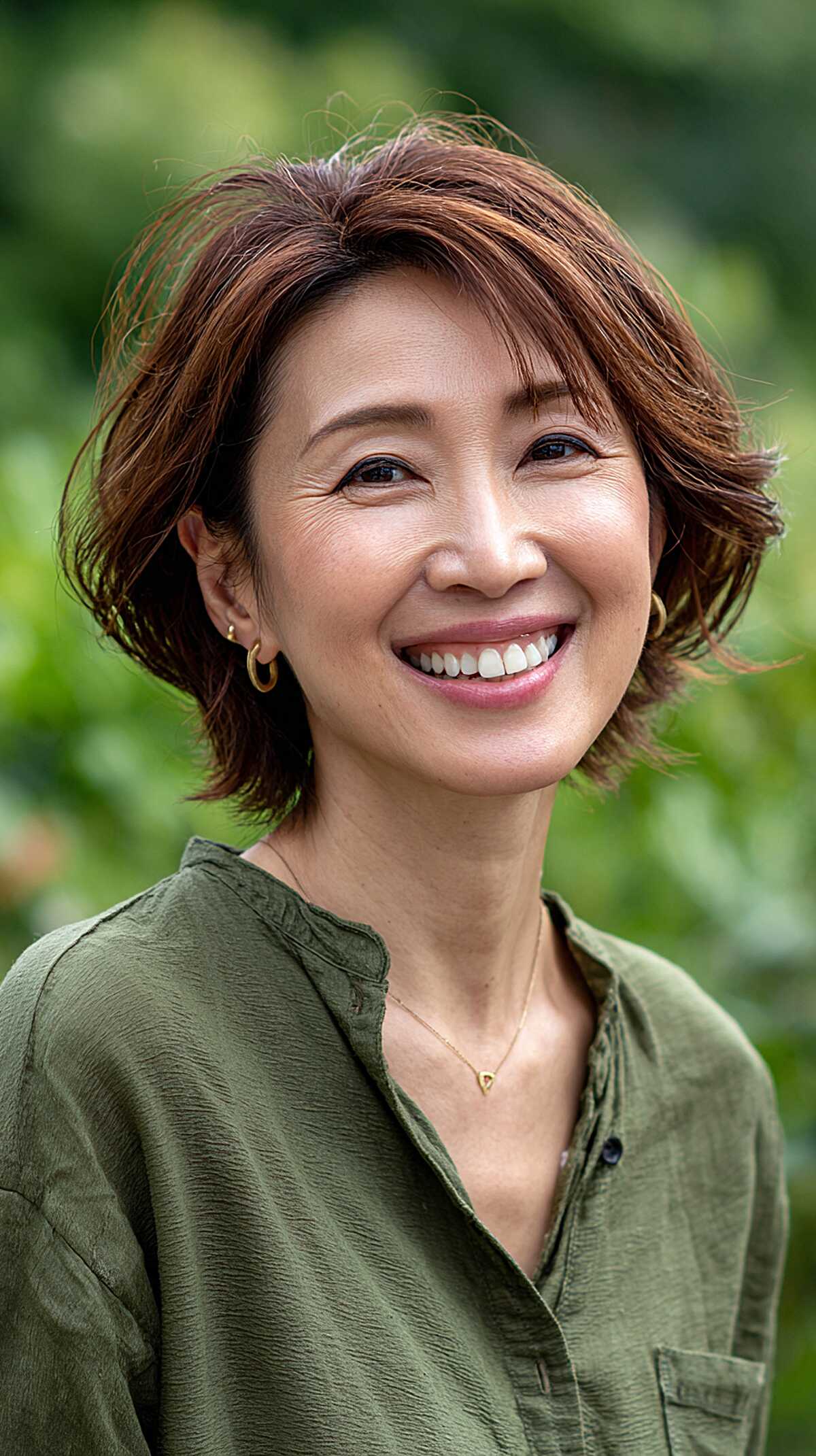 Short auburn layered cut with windswept texture and volume