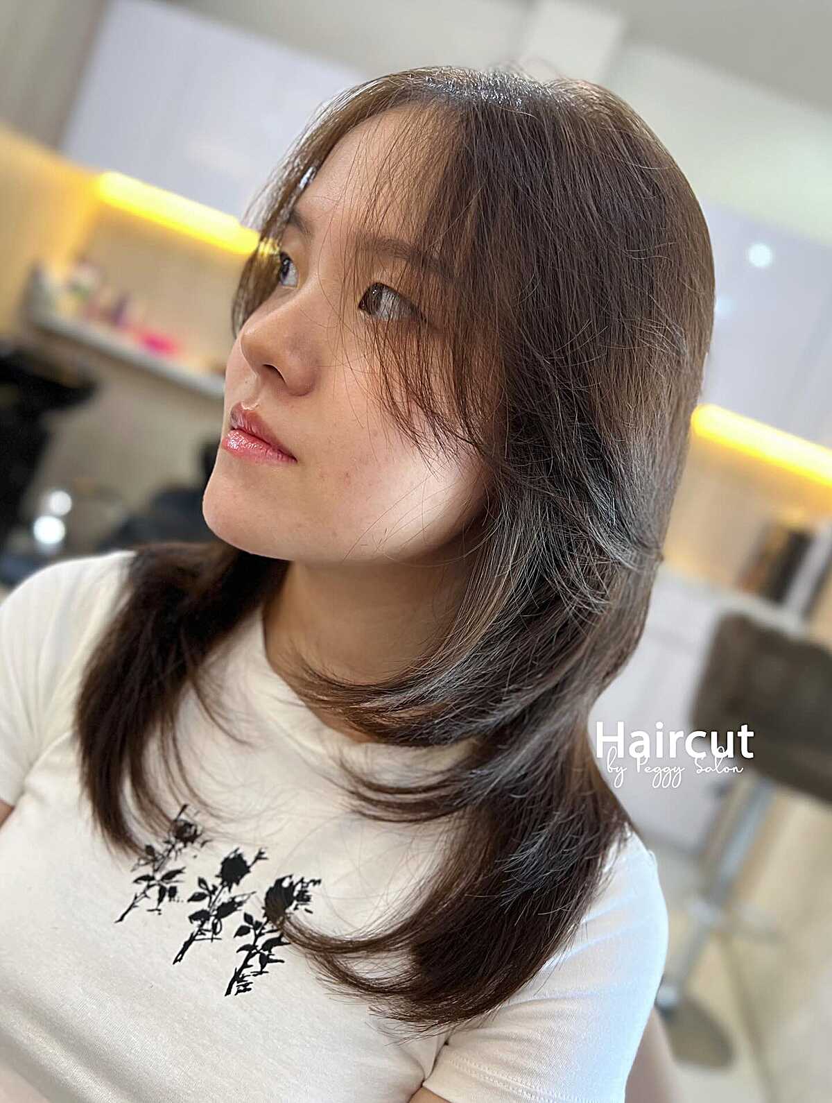 Long straight dark brown wolf cut with curtain bangs