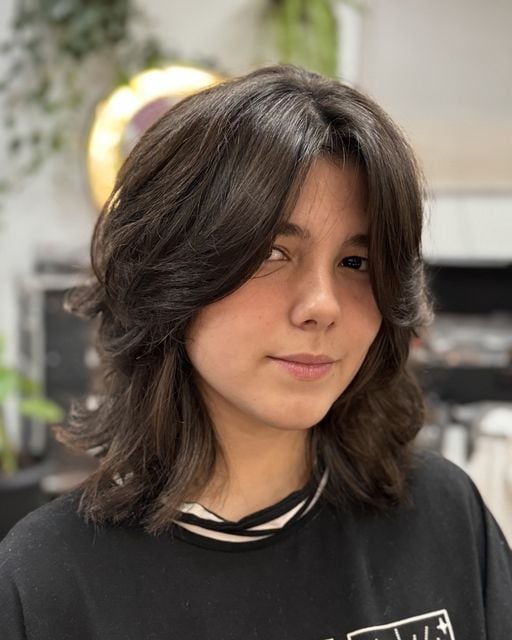 Dark shoulder-length wolf cut with flipped layers