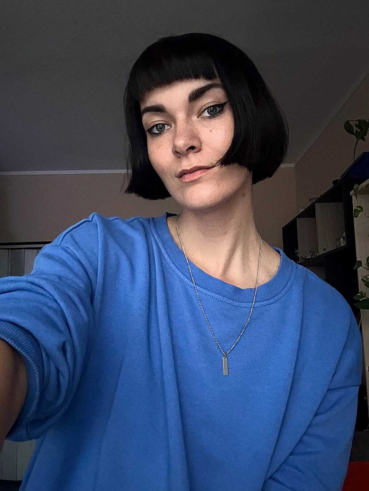 Black blunt chin-length bob with short baby bangs