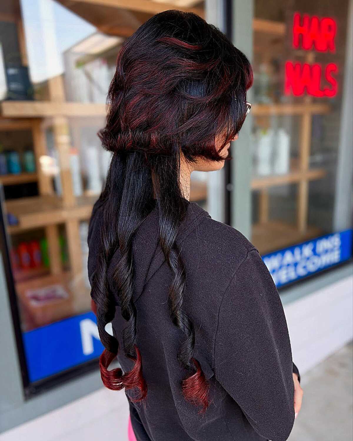 Black jellyfish cut with curled ends and dark cherry hints