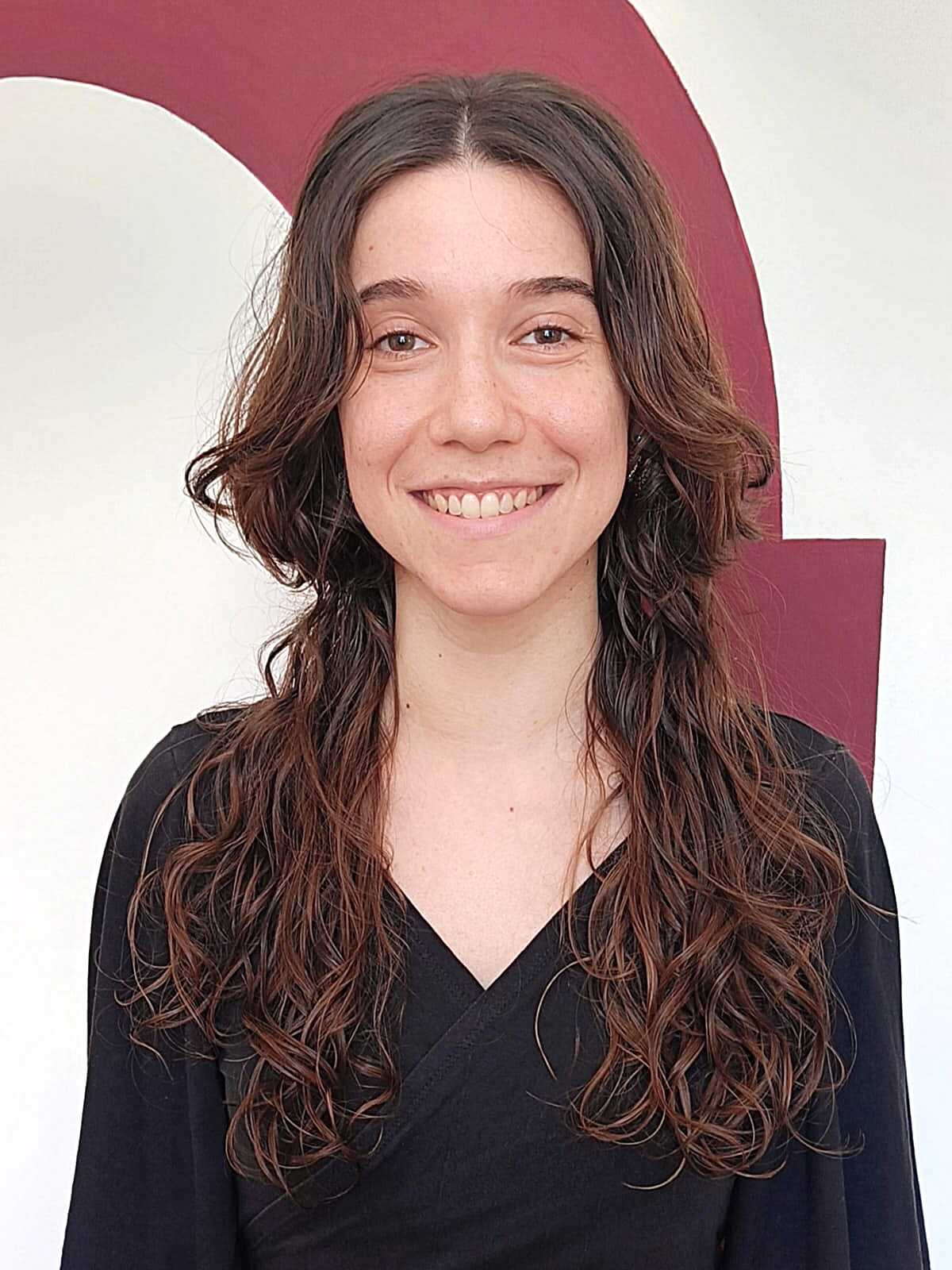 Natural curly brunette jellyfish cut with soft layers