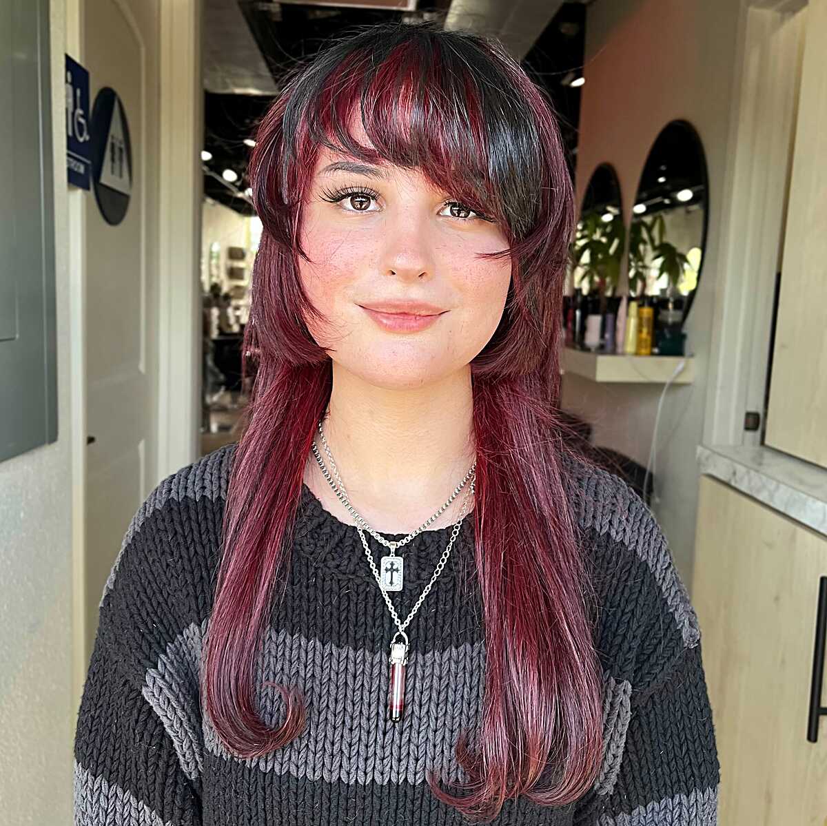 Dark cherry red jellyfish cut with full bangs and length