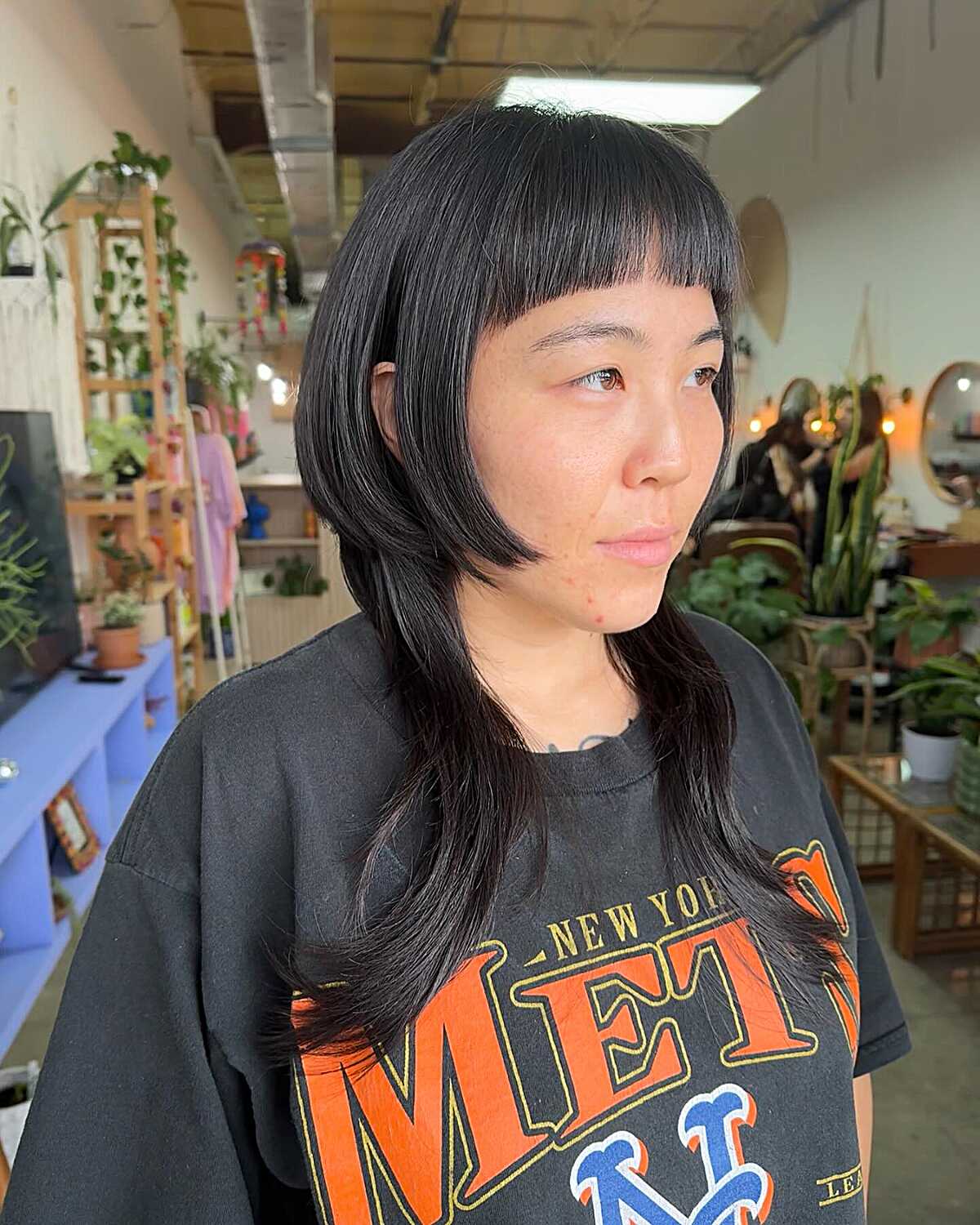 Jet black sleek jellyfish cut with blunt micro bangs