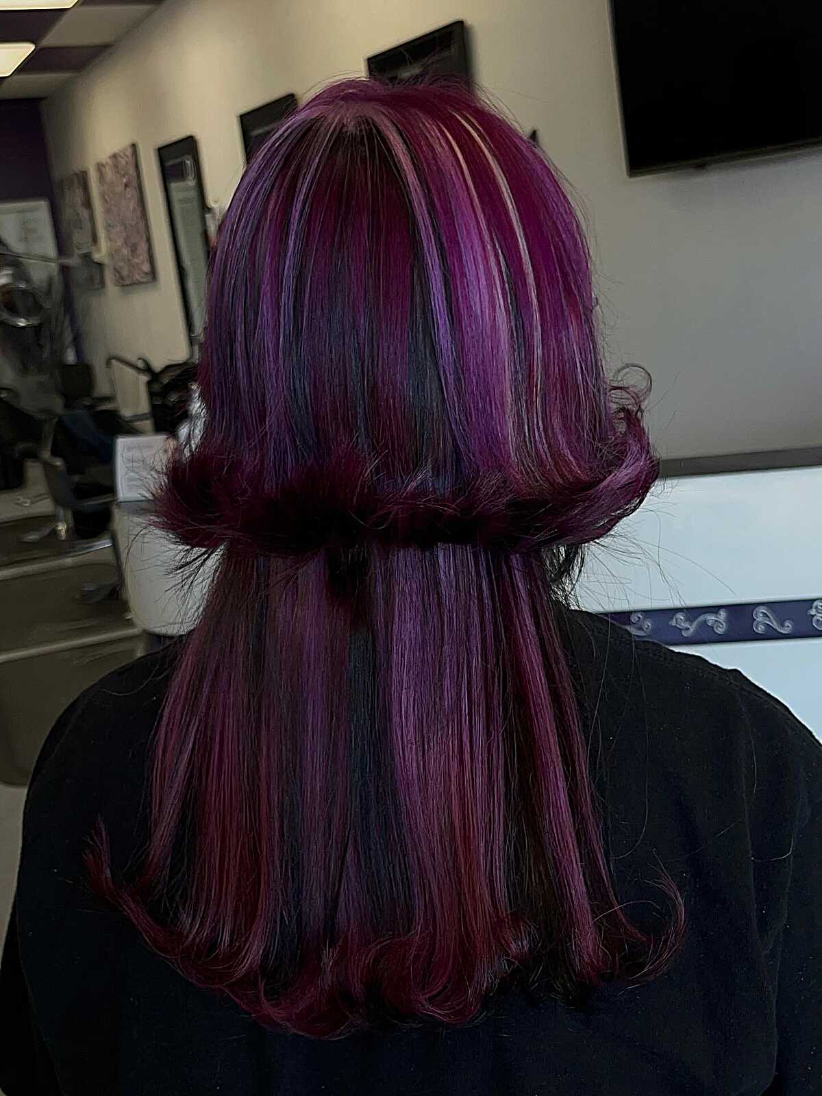 Back view of magenta and plum jellyfish with blunt shelf