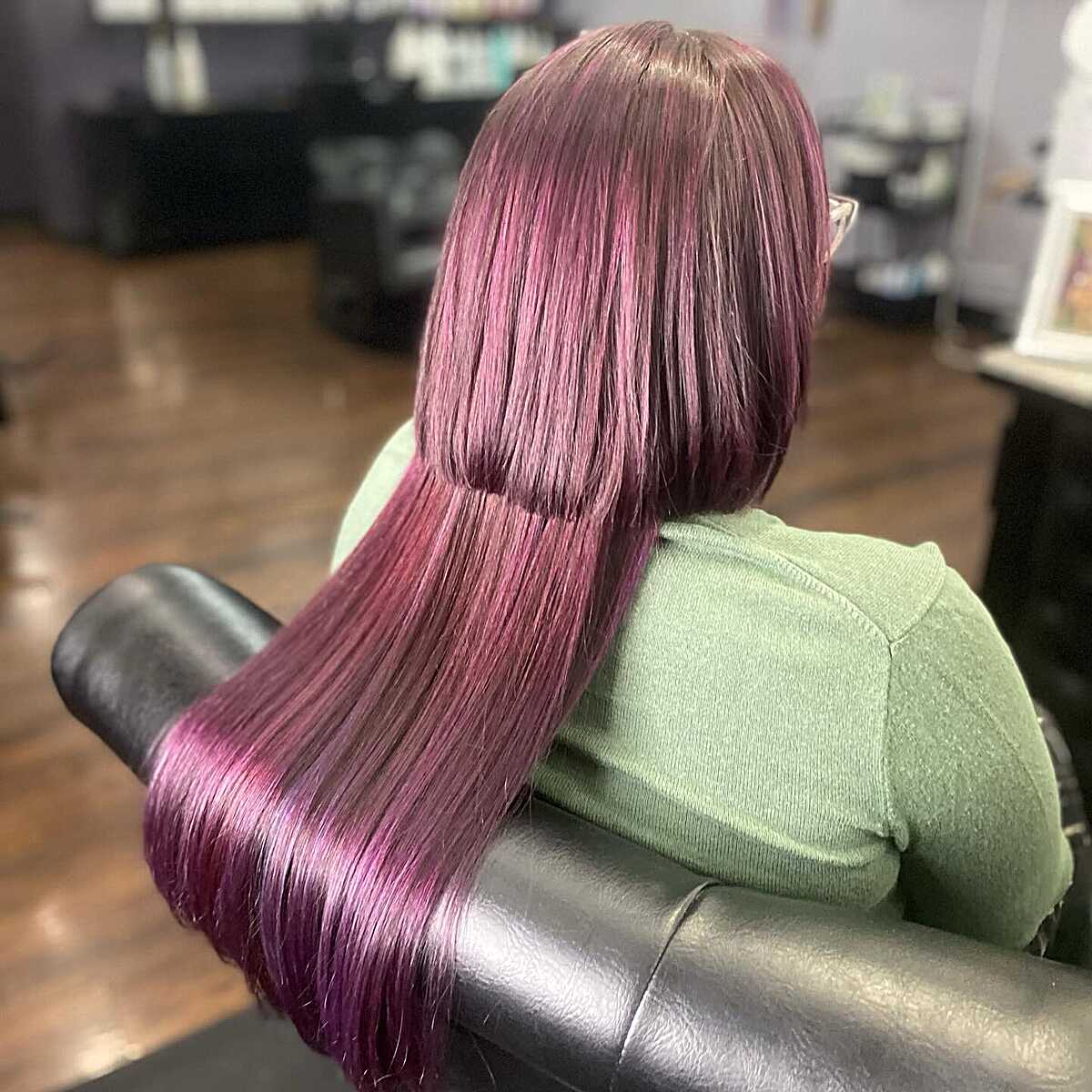Back view of sleek plum burgundy long jellyfish haircut