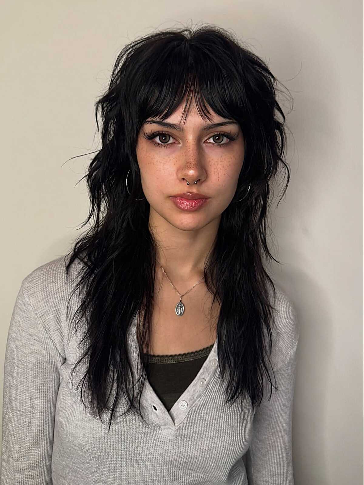 Long jet black shag mullet with wavy texture