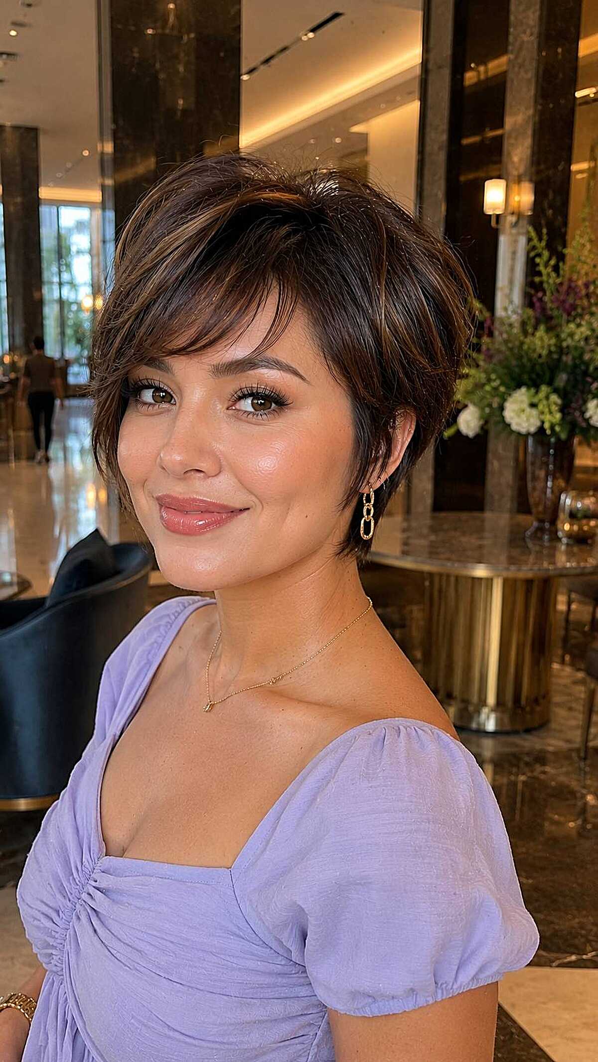 Layered pixie bob with caramel highlights and volume