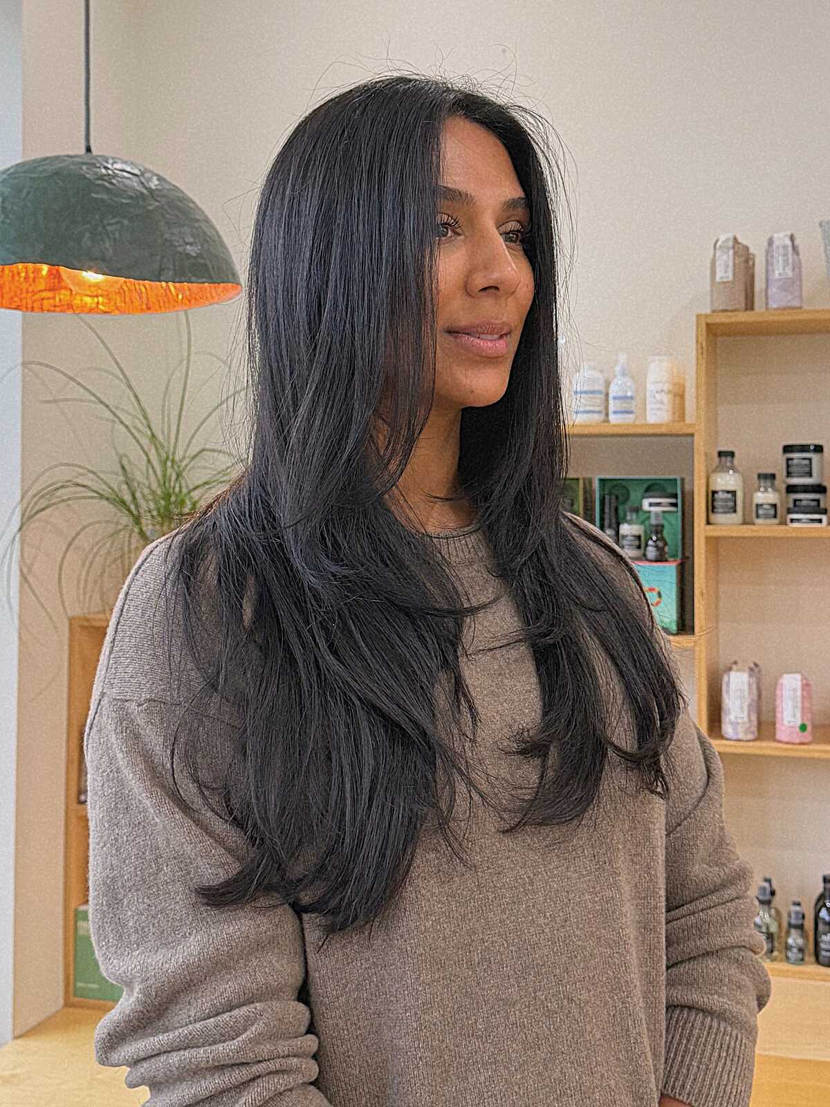 Long straight black hair with face-framing layers