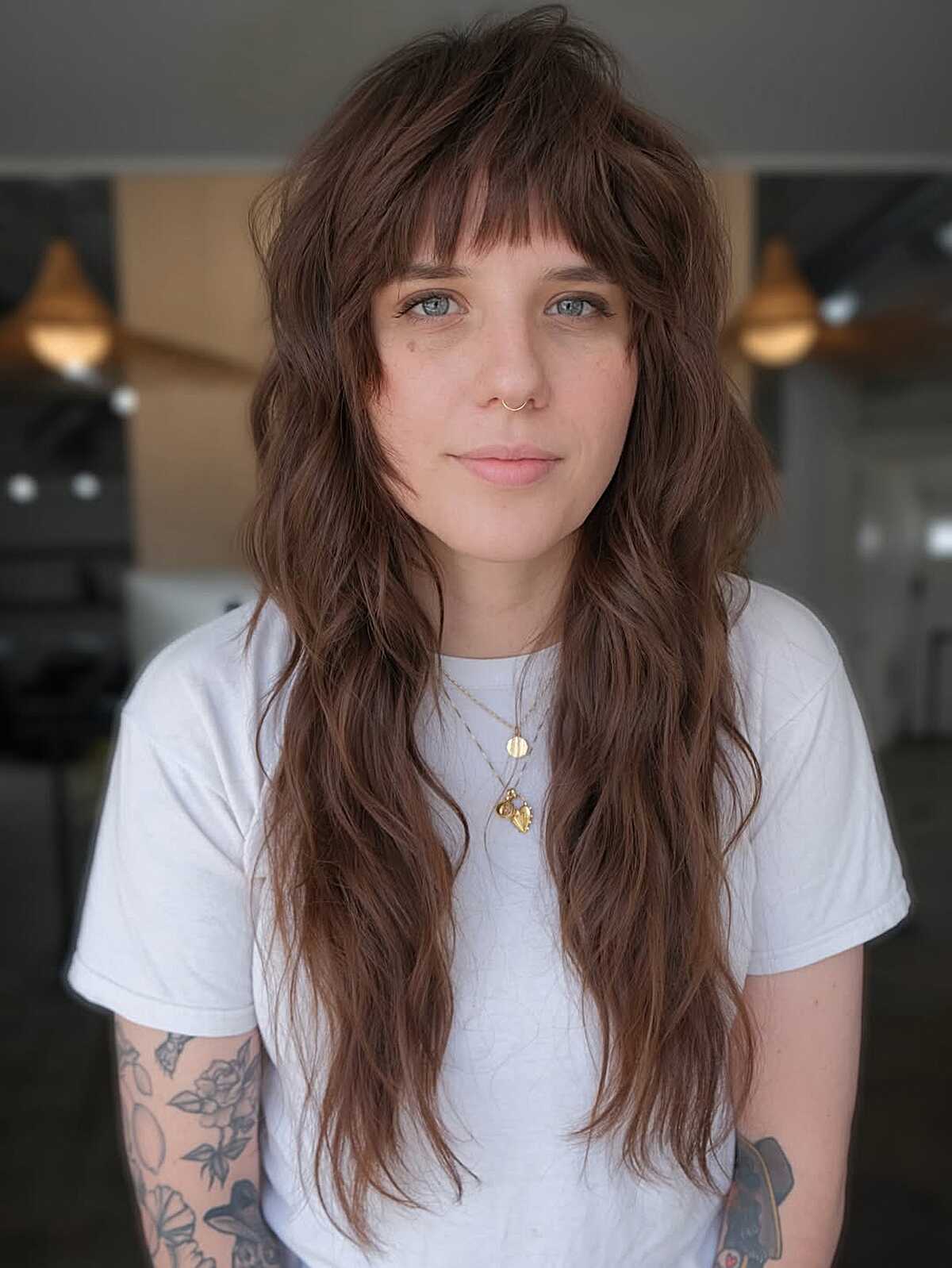 Long wavy brunette shag mullet with heavy bangs