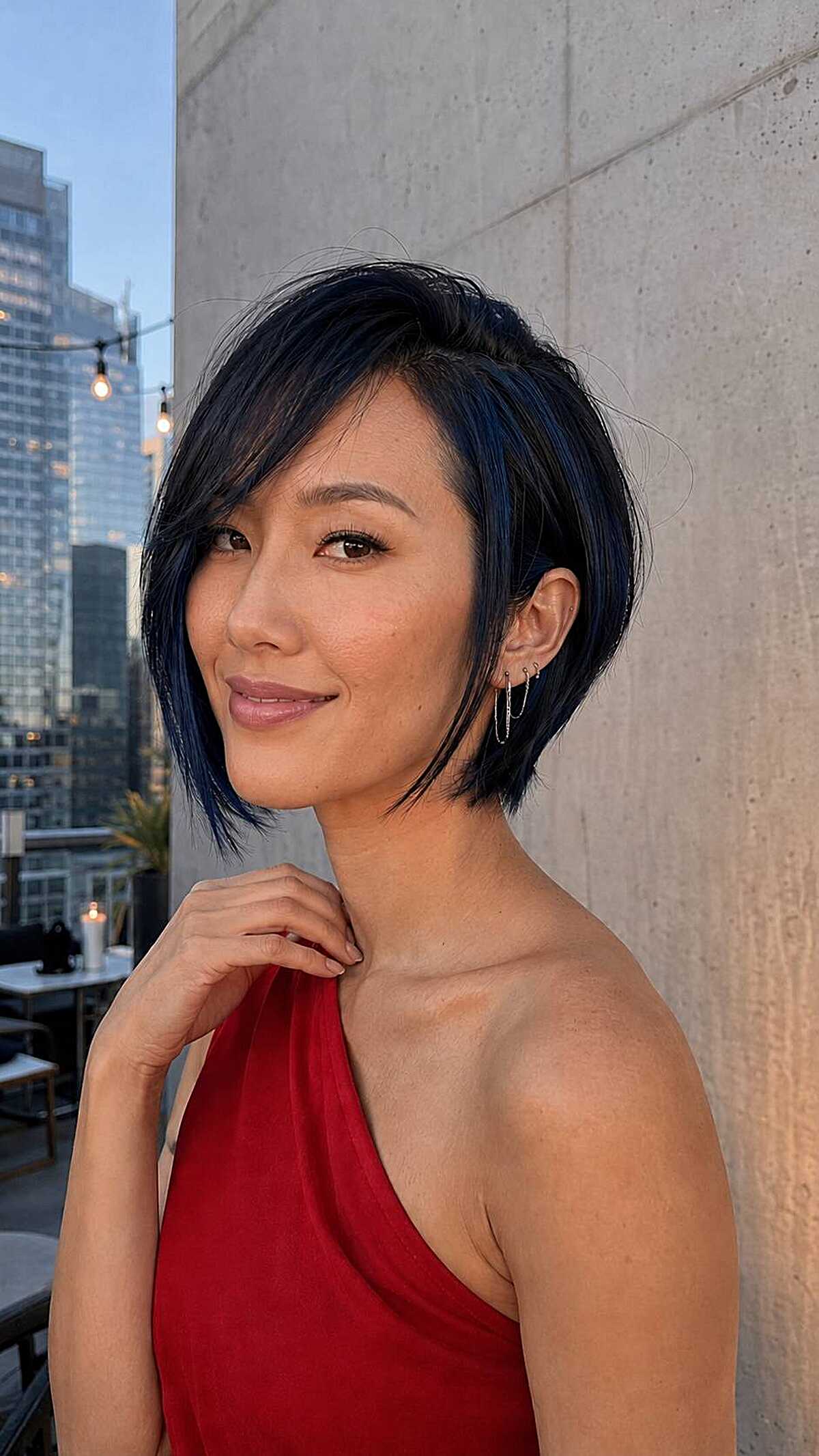 Sleek blue-black asymmetric bob with side part